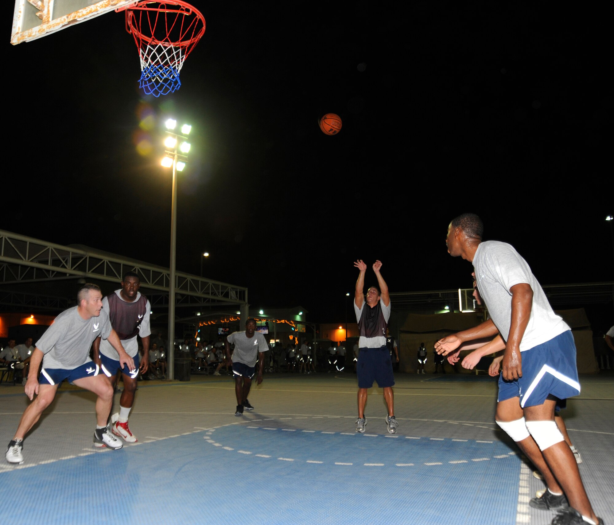 SOUTHWEST ASIA – Airman 1st Class, Ryan Britz, 380th Expeditionary Civil Engineer Squadron, Fire Department Basketball Team, shoots a free throw during a game against the Force Protection Team Aug. 4. The Force Protection Team won the game, 35 – 34. (U.S. Air Force photo/Senior Airman Stephen Linch)