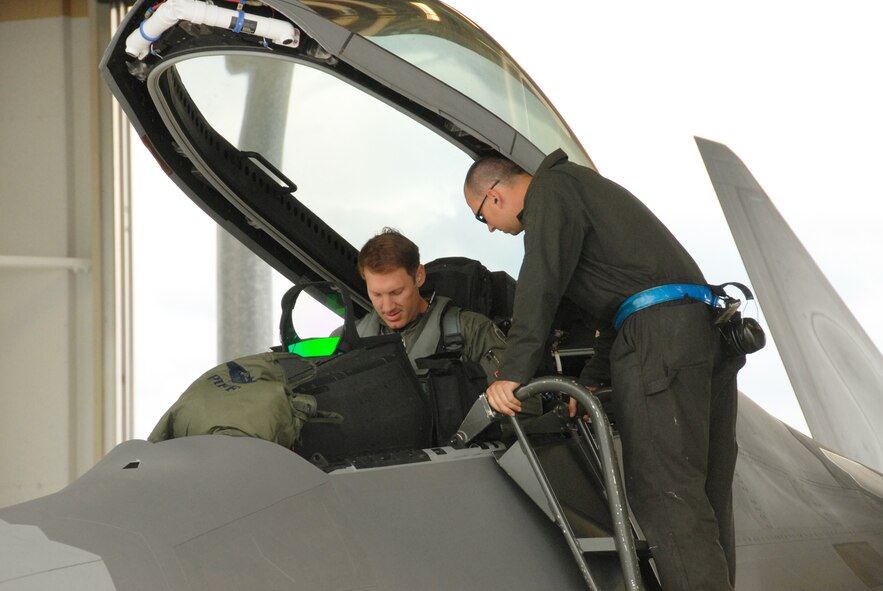 Airman 1st Class Adam Morehead, 3rd Wing Maintenance Squadron, and Lt. Col. David 'Piff' Piffarerio, 302nd Fighter Squadron, get ready to launch during Red Flag-Alaska July 30.  Red Flag-Alaska is a Pacific Air Forces commander-based field training exercise for U.S. coalition forces flown under simulated air combat conditions. It provides joint offensive counter-air, interdiction close air support, and large force employment training in a simulated combat environment.  Participating bases include Elmendorf and Eielson Air Force bases, Alaska, Holloman AFB, New Mexico, and Osan Air Base, South Korea.  This is the third Red Flag-Alaska exercise members of the 477th FG have participated in since the group's activation in 2007, training alongside their active-duty counterparts as part of Total Force Integration. (Air Force Photo / Maj. Cary McPartlin)