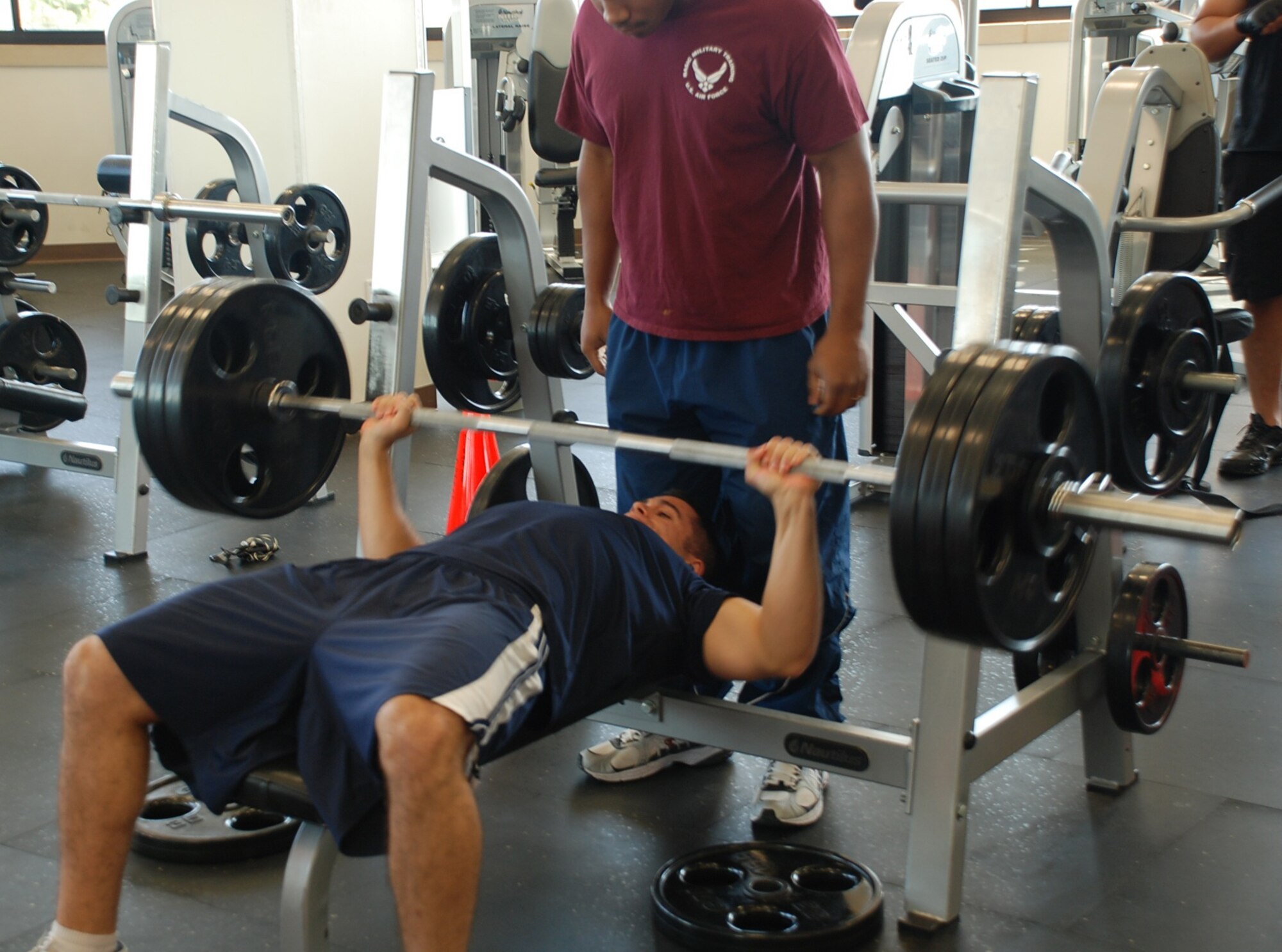 LAUGHLIN AIR FORCE BASE, Texas – Second Lt. Jimmy Tanis, 47th Operations Support Squadron, settles under the weight before lifting at the Bench Press competition at the Losano Fitness Center here July 25. Lieutenant Tanis was the top competitor out of 16 others, as he lifted 345 pounds, 168 pounds more than his body weight. Capt. Jessie Olson, 86th Flying Training Squadron, was the top female lifting 170 pounds. (U.S. Air Force photo by 2nd Lt. Eric Jones)