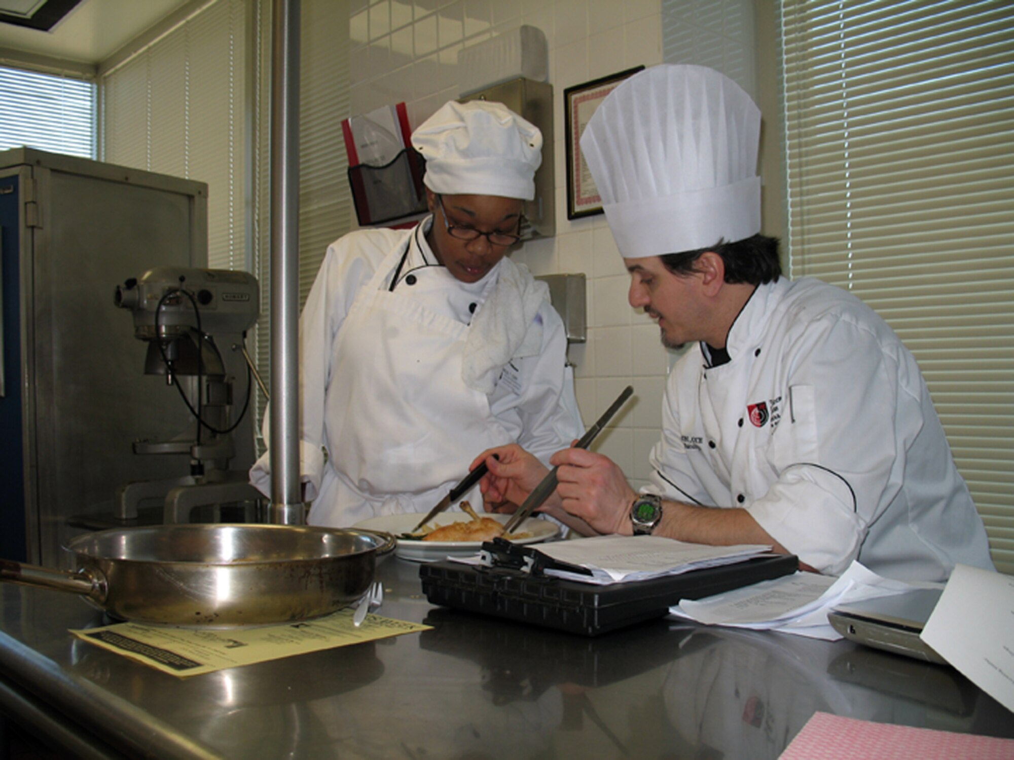 Aspiring chef Mical Terry, daughter of Tech. Sgt. Regena Johnson of the 94th Mission Support Squadron, receives instruction during a class at The International Culinary School at The Art Institute of Atlanta. Mical recently received a $20,000 scholarship to attend the school by winning an essay contest sponsored by the Food Network show, The Chef Jeff Project. Mical overcame the odds after she was diagnosed with cerebral palsy to fulfill her dreams of becoming a chef. (Courtesy Photo)