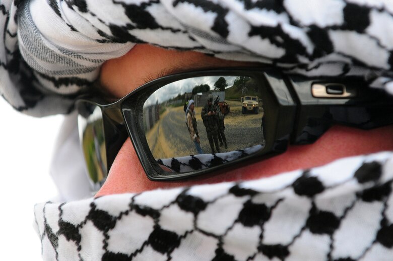 U.S. Air Force Senior Airman Truman Smith, a Tactical Air Control Party member from the 2nd Air Support Operations Squadron, plays an insurgent in convoy attack training for Allied Strike at Grafenwoehr, Germany, Aug. 3, 2009.  Allied Strike a multi-service, multi-national exercise presents realistic scenarios for participants to hone skills before deploying. (U.S. Air Force photo by Staff Sgt.  Jocelyn Rich)