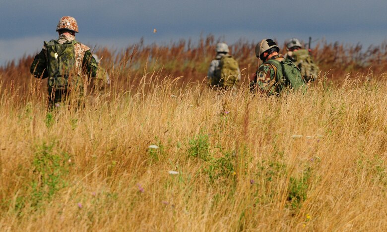 Participants in the exercise Allied Strike move to their rally point at Grafenwoehr, Germany, Aug. 3, 2009. Allied Strike a service, multi-national exercise presents realistic scenarios for participants to hone skills before deploying. (U.S. Air Force photo by Staff Sgt. Jocelyn Rich)