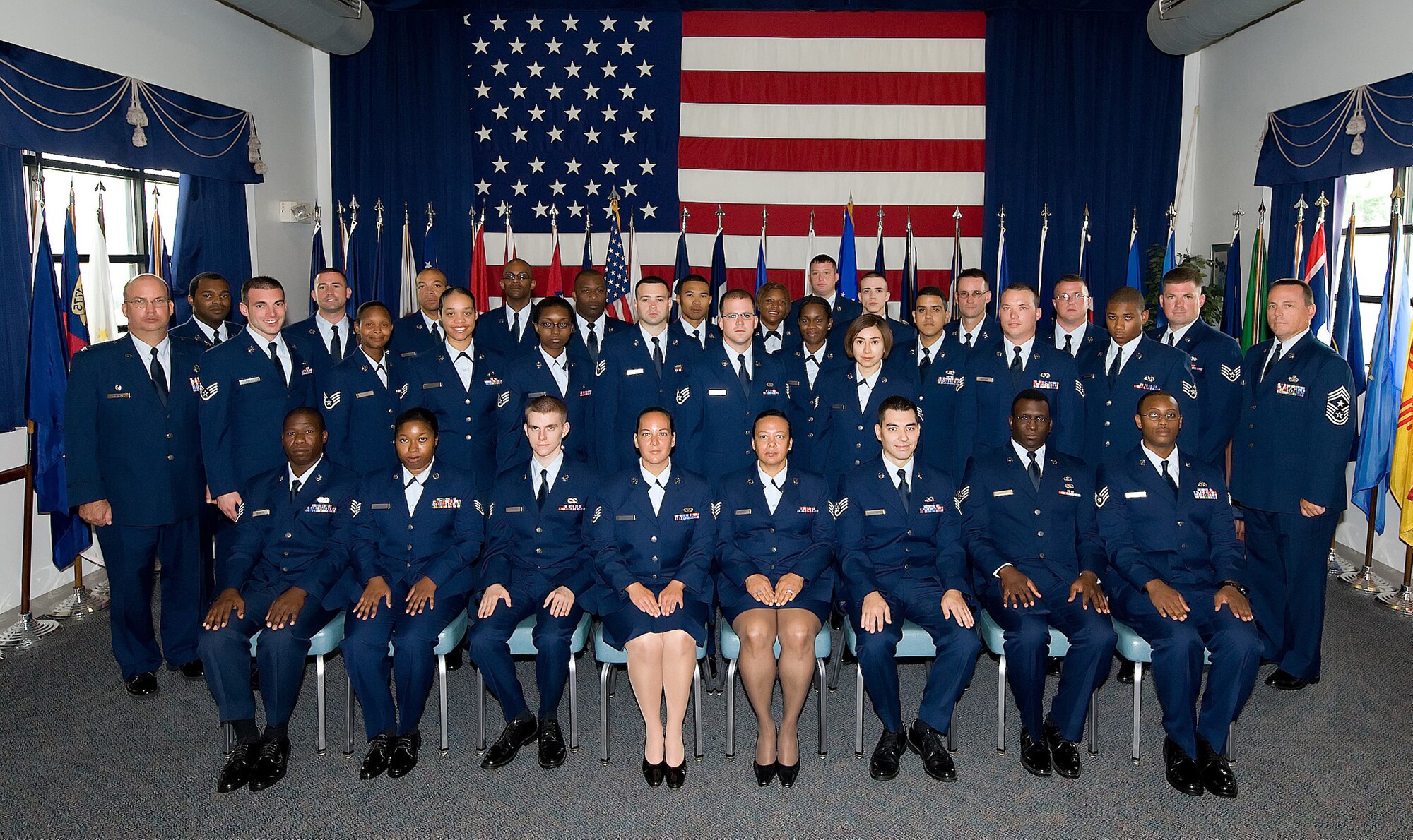 Thirty-one NCOs attended the 512th Airlift Wing NCO Induction Ceremony Aug. 2 at the Landings. The Airmen were promoted to staff sergeant over the past year. The ceremony, hosted by the wing's Top 3, formally inducted these Airmen into the NCO corps. (U.S. Air Force photo/Jason Minto)