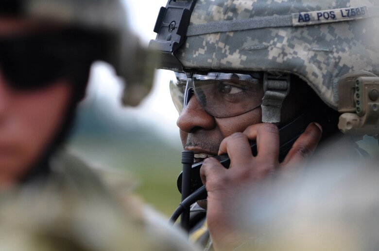 U.S. Air Force Staff Sgt. Weldon Leonard, a Tactical Air Control Party member from the 1st Air Support Operations Squadron, makes contact with the control center during an air strike exercise at Allied Strike, Grafenwoehr, Germany, Aug. 3, 2009. Allied Strike a service, multi-national exercise presents realistic scenarios for participants to hone skills before deploying. (U.S. Air Force photo by Staff Sgt.  Jocelyn Rich)