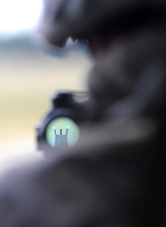 U.S. Air Force Airman 1st Class Matthew Aguirre, a Tactical Air Control Party, ROMAD from the 1st Air Support Operations Squadron, secures his position during Allied Strike, Grafenwoehr, Germany, Aug. 3, 2009. Allied Strike a multi-service, multi-national exercise presents realistic scenarios for participants to hone skills before deploying. (U.S. Air Force photo by Staff Sgt. Jocelyn Rich)