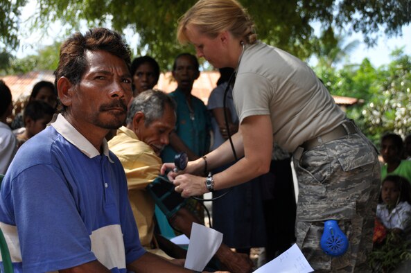 BIKELI, ATAURO – U.S. Air Force Maj. Julie Hanson, a nurse for the 3rd Medical Group, Elmendorf Air Force Base, Alaska, takes blood pressure readings and conducts health assessments while at the fishing village of Bikeli, Atauro, in support of  Pacific Angel on July 21, 2009. Pacific Angel is a 13th Air Force led humanitarian assistance operation aimed at improving military civic cooperation between the United States and Timor Leste.  (U.S.  Air Force photo/Tech Sgt. Cohen A. Young)