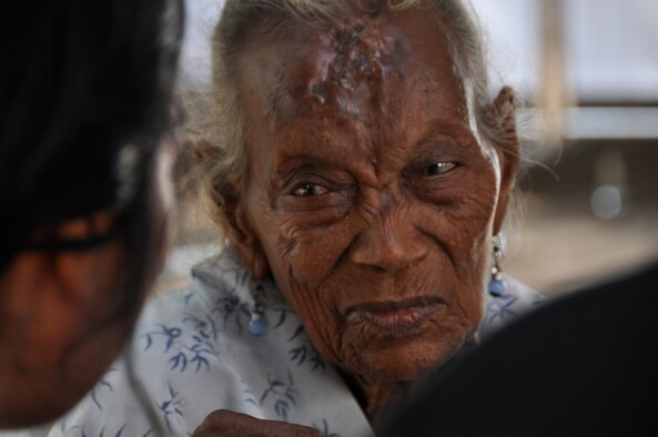 BIKELI, ATAURO – An East Timorese woman answers a few questions during a health assessment prior to having her vitals taken by U.S. Air Force medical personnel at the fishing village of Bikeli, Atauro, who supported Operation Pacific Angel 09 on July 21, 2009. Airmen, Soldiers from the Royal Australian Regiment, and the government of Timor Leste, provided basic medical care by checking vital signs, checking for Malaria, conducting health assessments and distributing antibiotics and Tylenol during a humanitarian visit. Pacific Angel is a 13th Air Force led humanitarian assistance operation aimed at improving military civic cooperation between the United States and Timor Leste.  (U.S.  Air Force photo/Tech Sgt. Cohen A. Young)