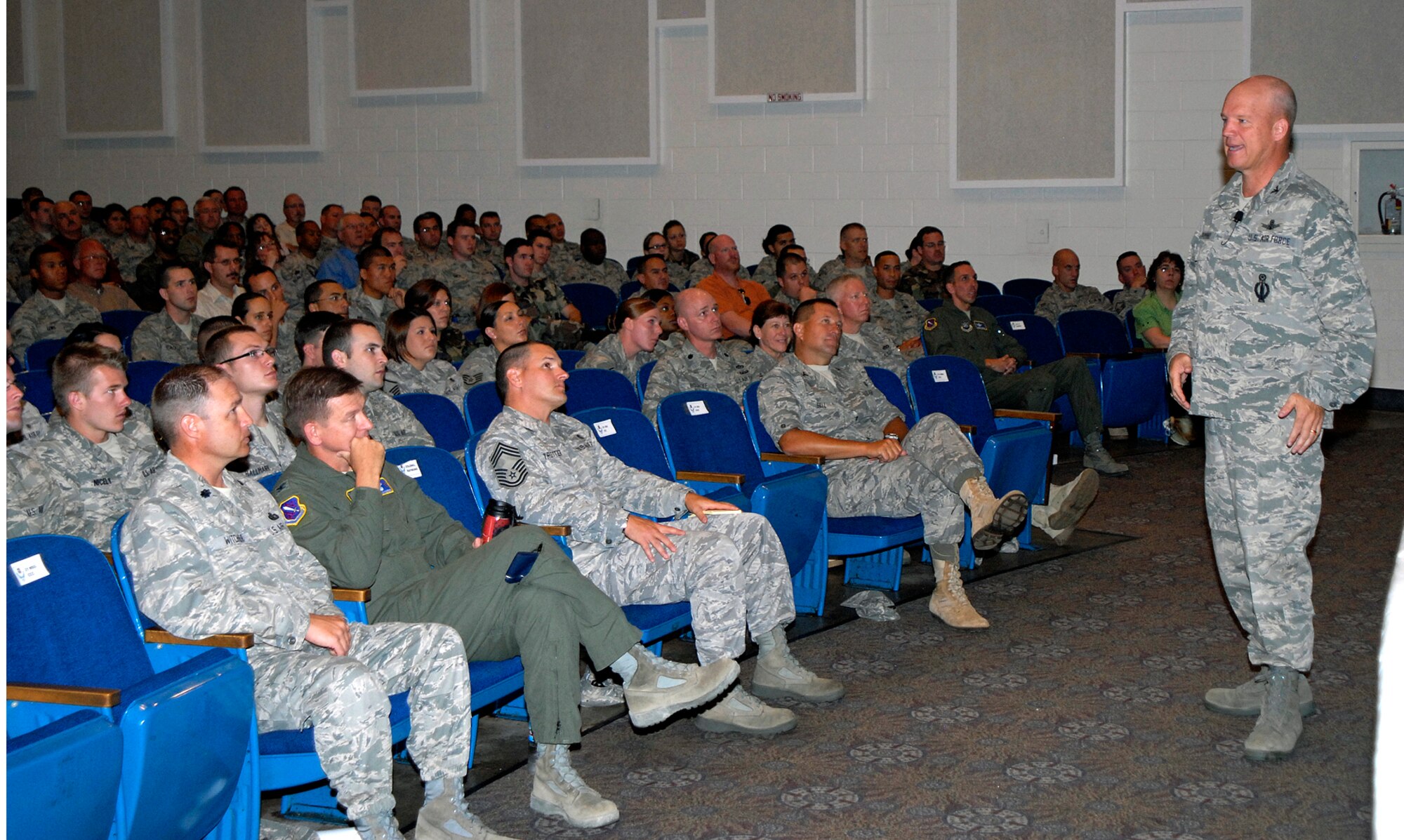PETERSON AIR FORCE BASE, Colo. -- Col. Jay Raymond, 21st Space Wing commander, addresses Peterson Airmen during his last scheduled commander’s call at the base auditorium Jul. 28. During his commander’s call, Colonel Raymond thanked all Peterson Airmen for making his tour of duty as commander a rousing success. Colonel Raymond is slated to PCA to Air Force Space Command headquarters, where he will serve as the director of plans, programs and analysis. Colonel Raymond has served as 21st SW commander since Sept. 2007. (Air Force Photo by Craig Denton)