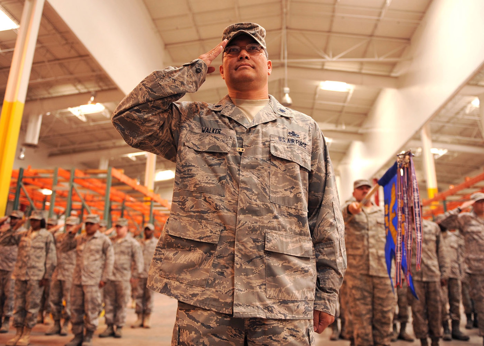 HOLLOMAN AIR FORCE BASE, N.M. -- Lt. Col. William Walker, 49th Material Maintenance Group deputy commander, leads the group's flights in its first salute to Col. Masao Hendrix, new 49th MMG commander in a ceremony at Bear Base here, July 31.  The 49th MMG was led by Col. William Goad for three years before Colonel Hendrix assumed command.  (U.S. Air Force photo by Senior Airman John D. Strong II)