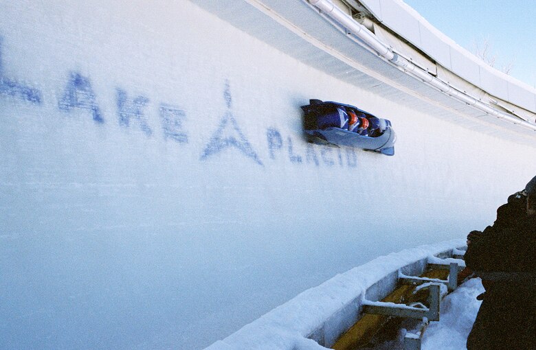 Sgt. Michael Bradley, 34th Fighter Squadron Life Support technician, drives the U.S. Bobsled team's bobsled from the front during a recent trial run, followed by teammates Ben Fogel, Derek Kresser and Hoy Thurman.
