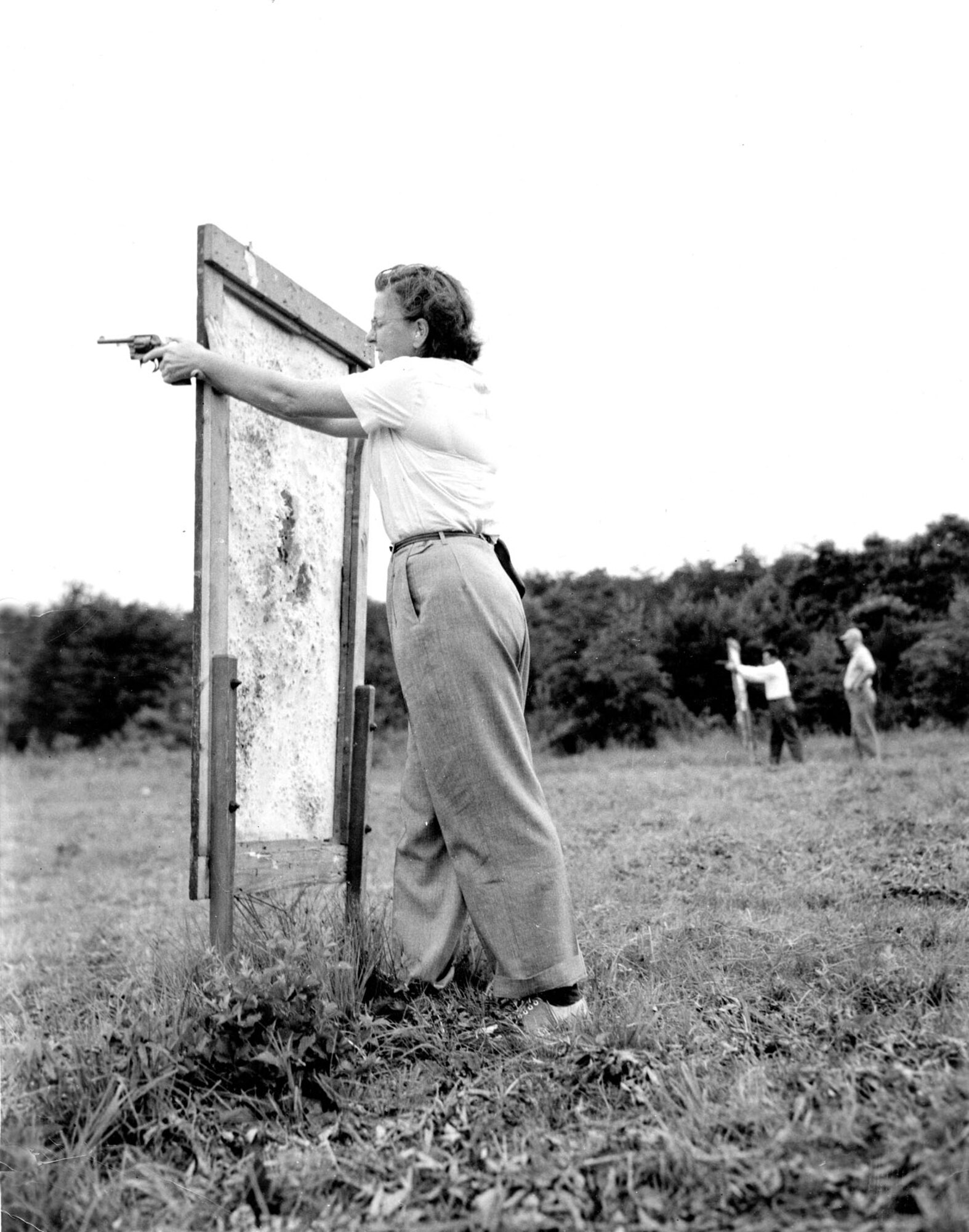 Special Agents must know how to search suspects and use firearms. These training scenes are from 1949 at Fort George Meade, Md. (U.S. Air Force photo)