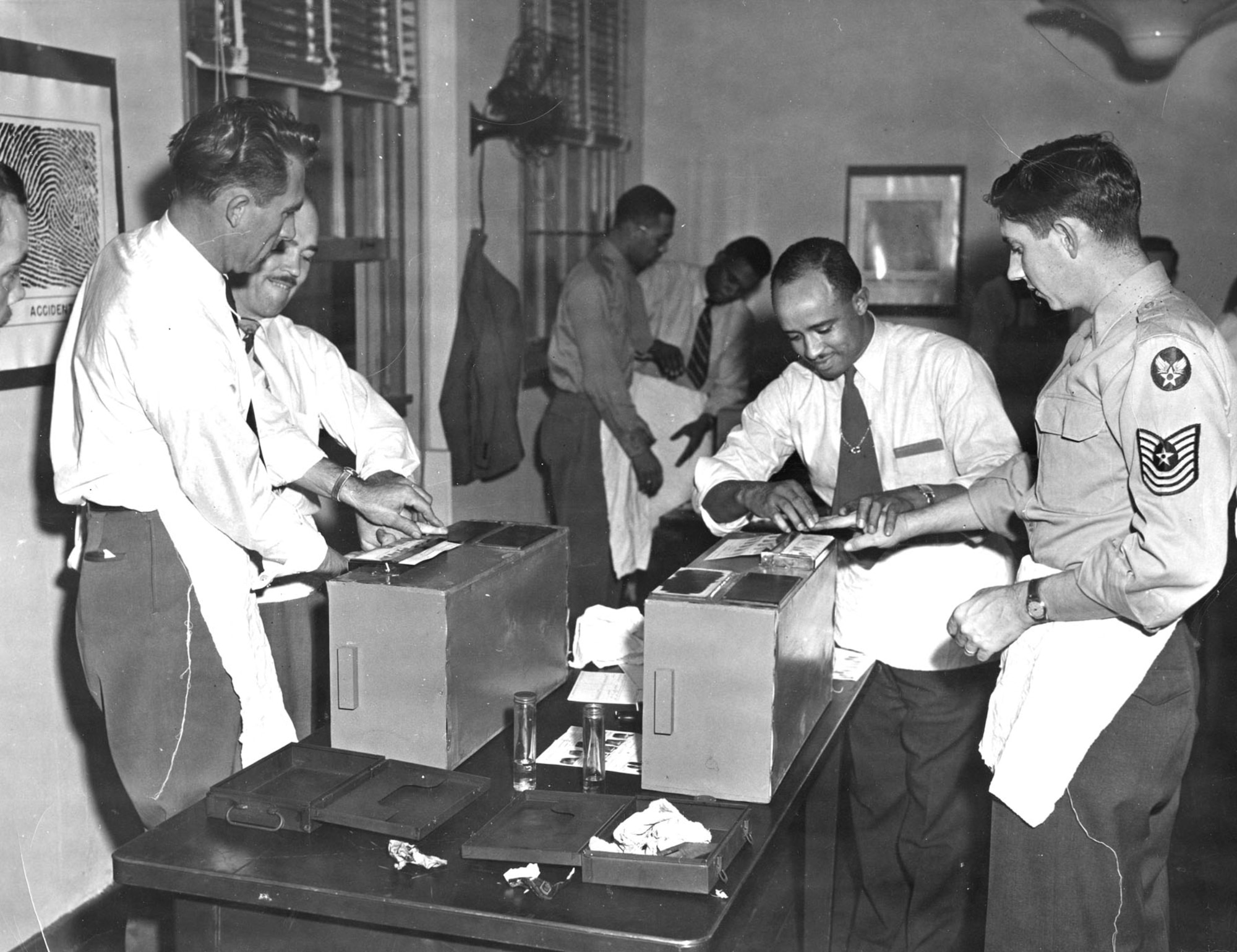 OSI Special Agents learn a variety of investigative skills. This scene from 1949, shortly after AFOSI’s creation, shows agents learning about fingerprinting. (U.S. Air Force photo)