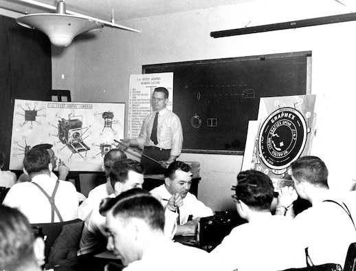 OSI Special Agents learn a variety of investigative skills. This scene from 1949, shortly after AFOSI’s creation, shows agents learning about photography. (U.S. Air Force photo)