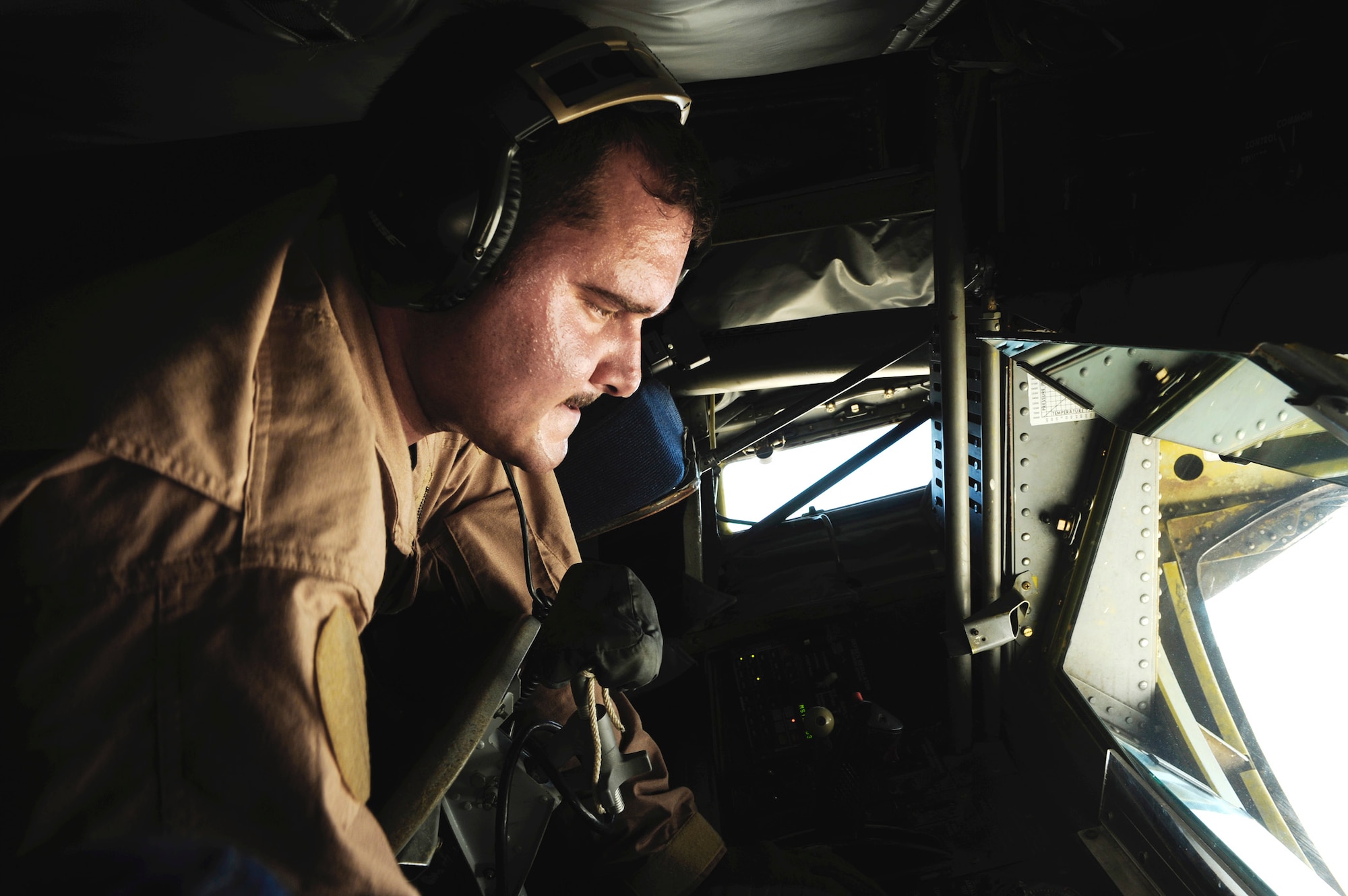 Boom operator Staff Sgt. Jon Adams inspects the boom controls on a KC-135 Stratotanker in Southwest Asia. He is assigned to the 340th Expeditionary Air Refueling Squadron. (U.S. Air Force/Staff Sgt. Michael B. Keller) 