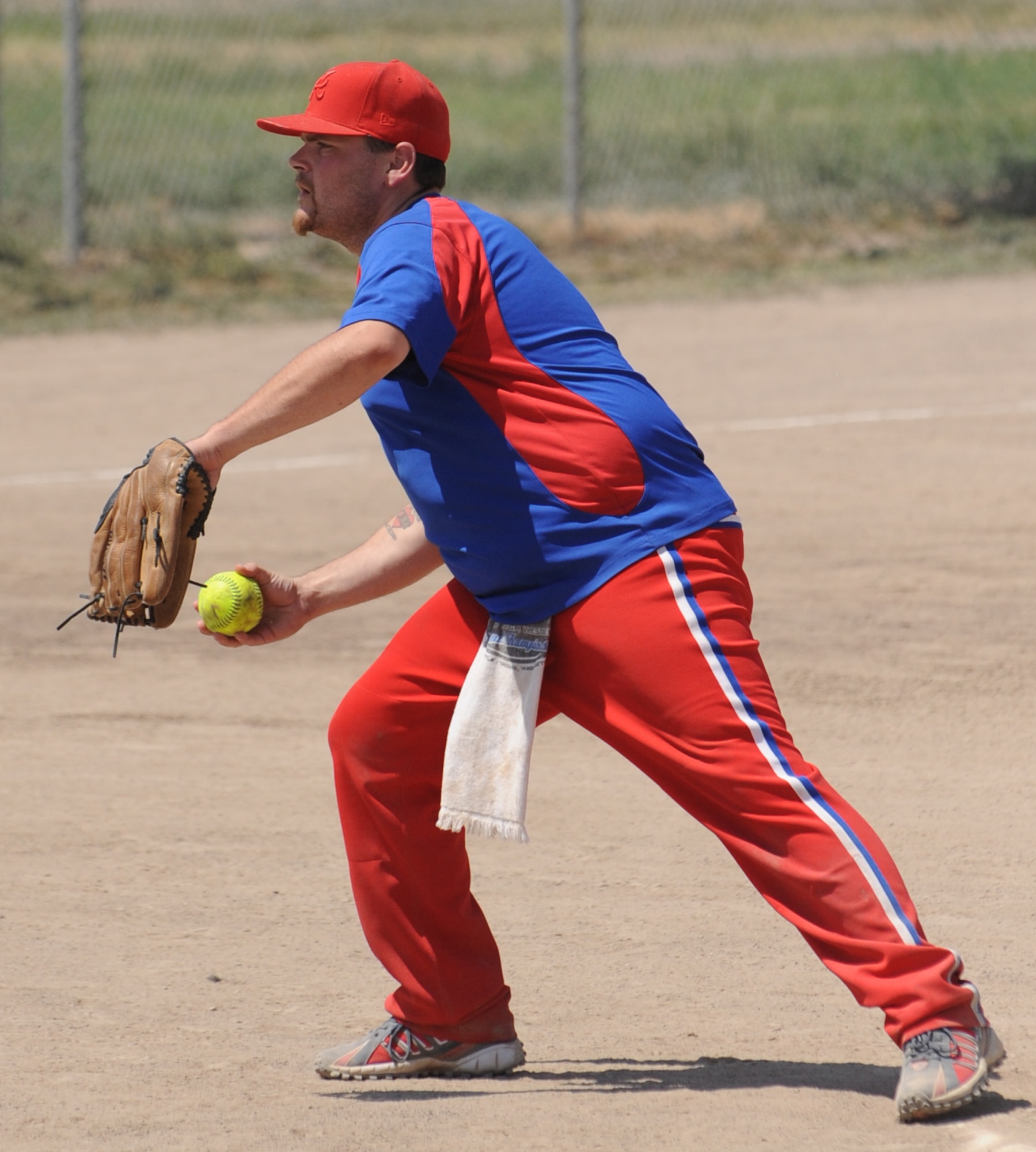 MOUNTAIN HOME AIR FORCE BASE, Idaho-- Brad Watkins, Thrifty's Shake ‘n Bake pitcher, takes his stance in the pitchers circle during the championship game of the Operation Warmheart Tournament Aug 2. Thrifty's Shake ‘n Bake beat Ammo "A" 15-5. The softball tournament, won by Thrifty's Shake ‘n Bake for the third year in a row, kicked off at 3 p.m. July 31 and ran through Aug. 2 with games played 24 hours a day. Operation Warmheart -- run by the first sergeants council and other committee members -- raises funds to help military families when times get tough financially. (U.S. Air Force photo by Airman 1st Class Renishia Richardson)