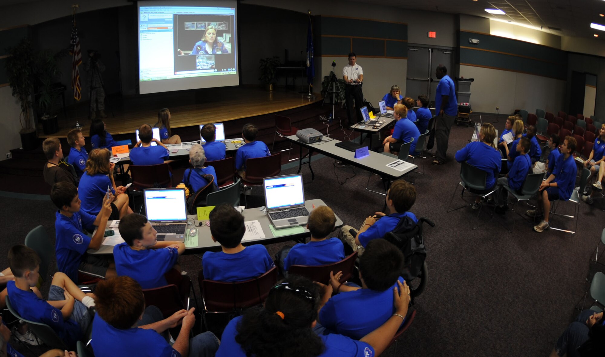 WHITEMAN AIR FORCE BASE, Mo. - At the Community Activities Center students from Youth Center gather around computer stations to begin aiding astronauts during Challenger Learning Centers E- Mission, July 31. The Challenger Learning Center was created in honor of those lost in the Challenger STS-51-L mission that exploded shortly after liftoff. (U.S. Air Force photo/Airman 1st Class Carlin Leslie)