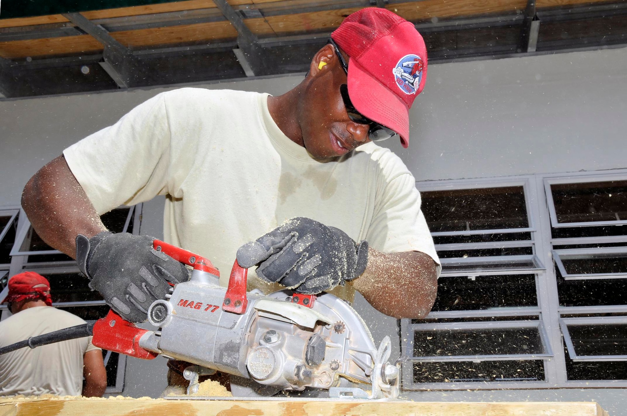 Tech. Sgt. Arren Sennet, a structural craftsman with the 555th Red Horse Squadron, Nellis Air Force Base, Nev., uses a circular saw to cut a piece of wood for the window sills that will go into the new Bel Air school Aug 3, 2009 in Georgetown, Guyana. Airmen from the 555th Red Horse Squadron and the 910th Civil Engineer Squadron, Youngstown Air Reserve Station, Ohio, are deployed here to build the $230,000, and install over $37,000 in playground equipment. (U.S. Air Force photo by Airman 1st Class Perry Aston) (Released)