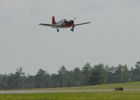 A Naval T-34 Turbo Mentor, performs a touch-n-go procedure over the Duke Field runway Aug. 3.  The training aircraft is used at NAS Whiting Field, but occasionally performs approaches here.  NAS Whiting Field also provides training for U.S. Marine Corps, Coast Guard, and Air Force student pilots, as well as several allied nations.  (U.S. Air Force photo/Staff Sgt. Samuel King Jr.)
