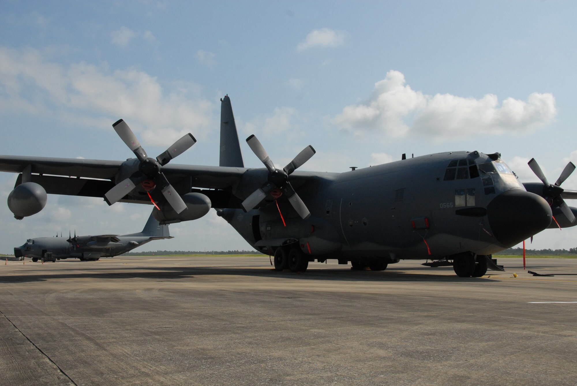 Two 919th Special Operations Wing MC-130s await a mission Aug. 3 morning at Duke Field.  Duke Field, an Eglin Air Force Base Reserve tenant base, is home to the only special operations wing in Air Force Reserve Command. The unit employs nearly 1,200 reservists.  The MC-130 provides infiltration, exfiltration and resupply of special operations forces and equipment in hostile or denied territory.  Secondary missions include psychological operations and helicopter air refueling.  (U.S. Air Force photo/Staff Sgt. Samuel King Jr.)