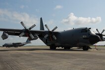 Two 919th Special Operations Wing MC-130s await a mission Aug. 3 morning at Duke Field.  Duke Field, an Eglin Air Force Base Reserve tenant base, is home to the only special operations wing in Air Force Reserve Command. The unit employs nearly 1,200 reservists.  The MC-130 provides infiltration, exfiltration and resupply of special operations forces and equipment in hostile or denied territory.  Secondary missions include psychological operations and helicopter air refueling.  (U.S. Air Force photo/Staff Sgt. Samuel King Jr.)