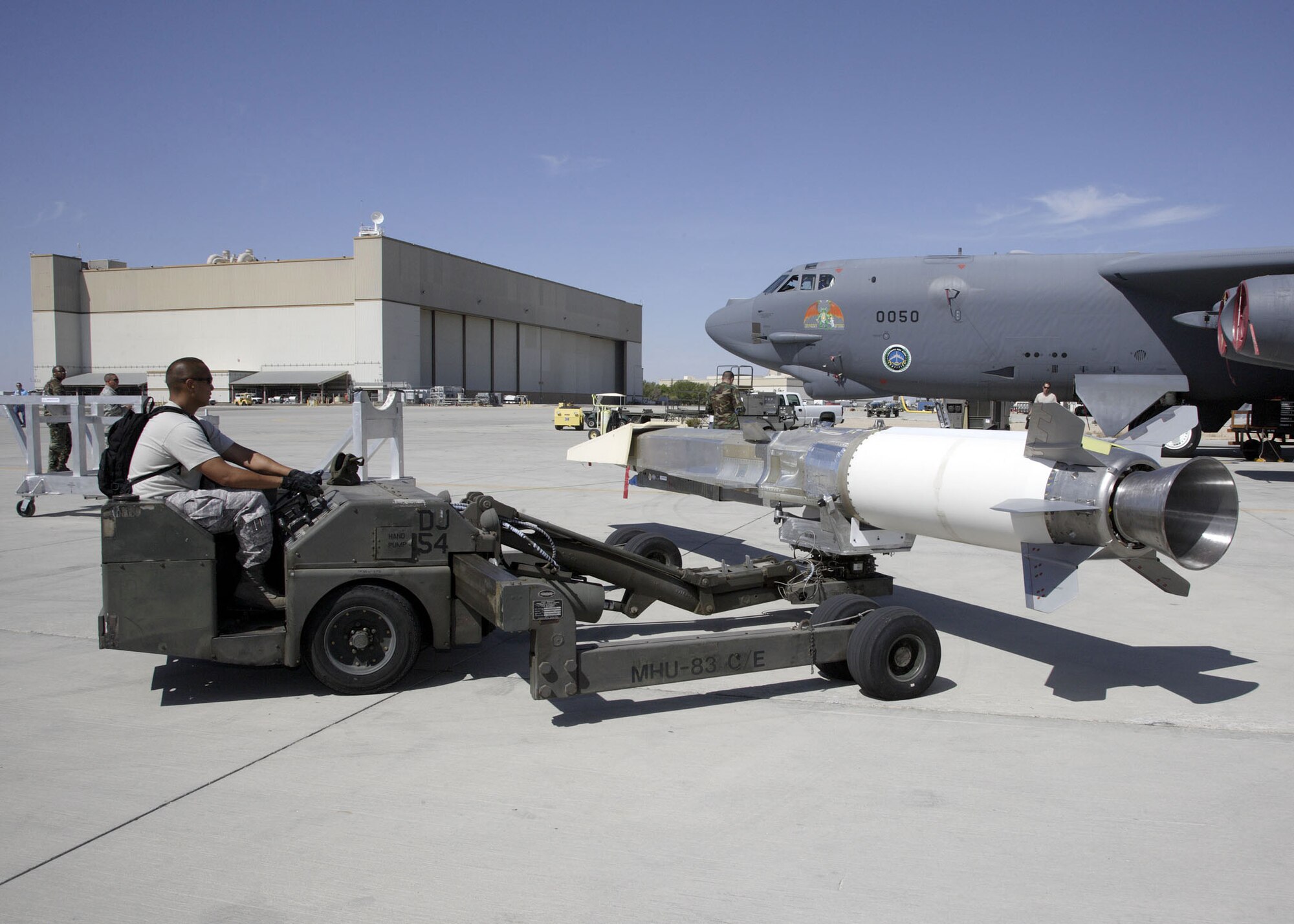 Staff Sgt. Jonathan Young with the 412th Maintenance Group prepares to upload the X-51A WaveRider hypersonic flight test vehicle to a B-52 for fit testing at Edwards Air Force Base on July 17.  Two B-52 flights, one captive carriage and one dress rehearsal, are planned this fall prior to the X-51's first hypersonic scramjet flight over the Pacific Ocean scheduled in December.  The Air Force Research Laboratory, DARPA, Pratt & Whitney Rocketdyne, and Boeing are partnering on the X-51A technology demonstrator program. (U.S. Air Force photo/Chad Bellay)
