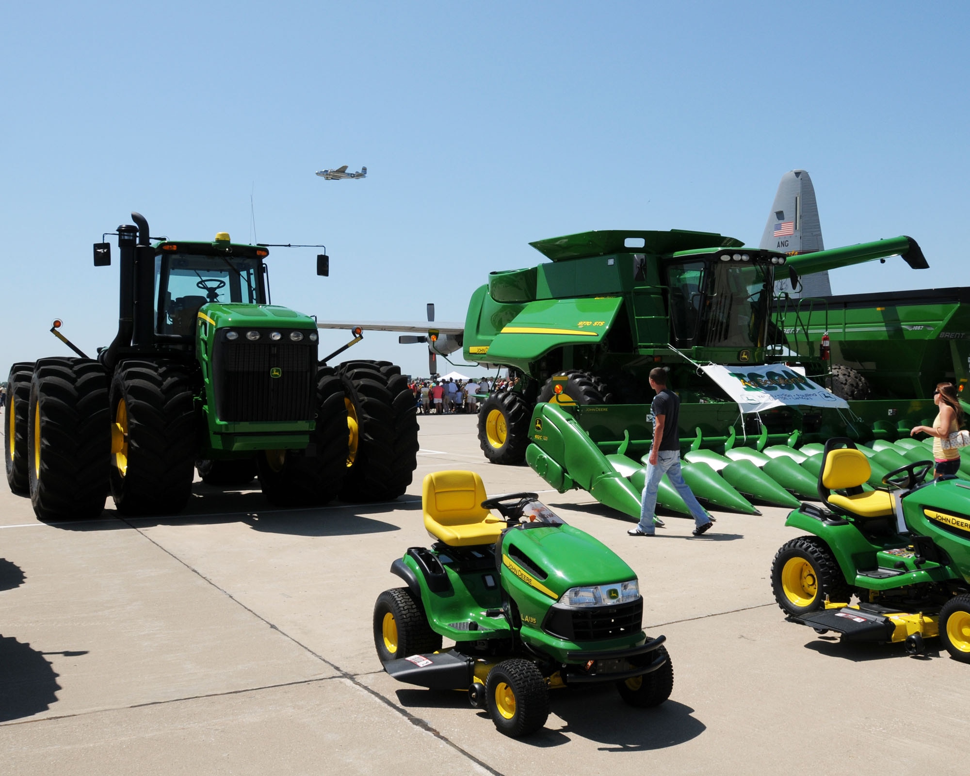 Combines and tractors of all sizes were on display beside various aircraft filling the ramp at the Sioux Gateway Airport / Col. Bud Day Field, in Sioux City, Iowa, as a B25 flies overhead.  This was all a part of the unique Air & Ag Expo hosted by the 185th Air Refueling Wing.
Official Air Force Photo by: MSgt. Bill Wiseman (released)