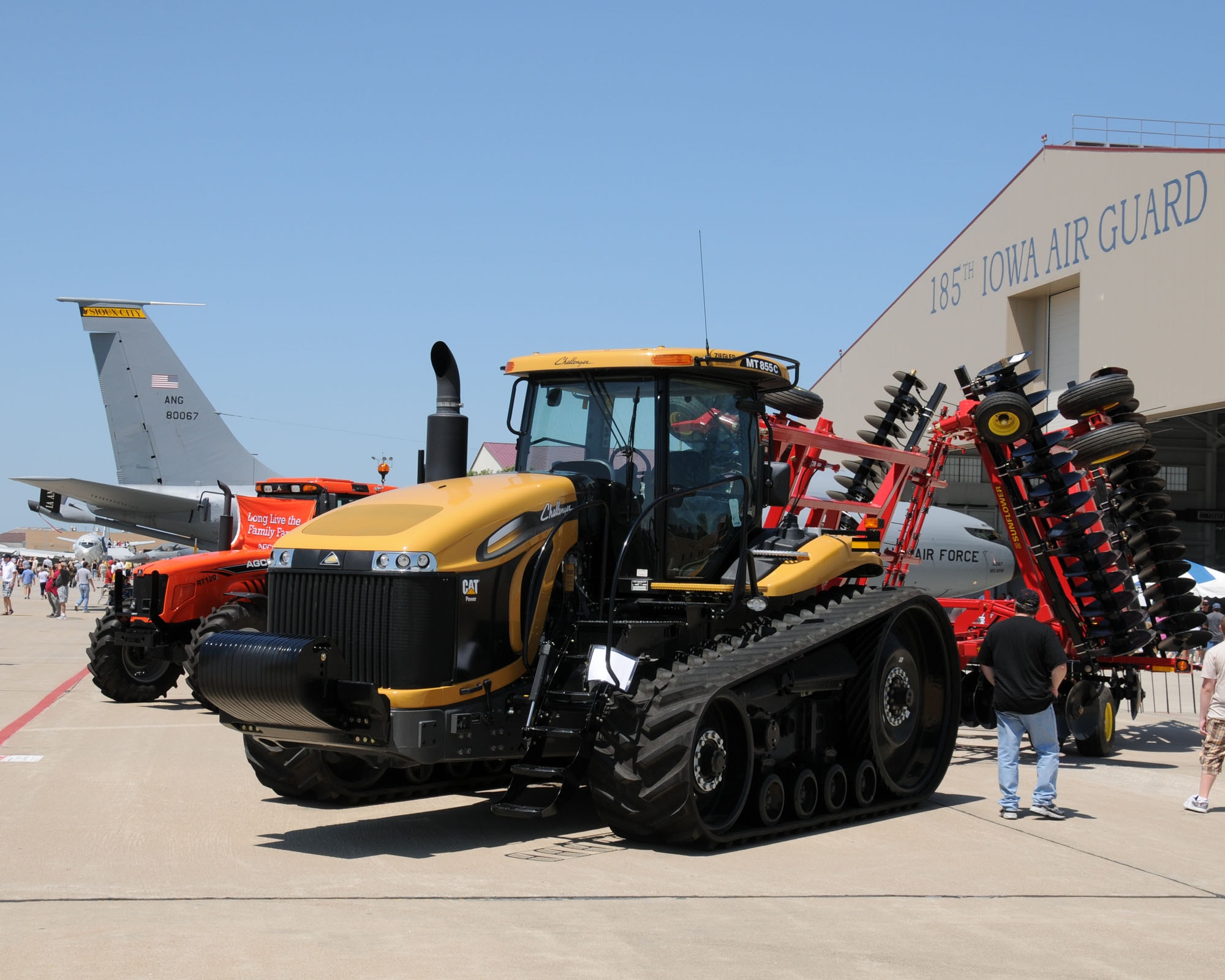 Tractors of all sizes were on display beside various aircraft filling the ramp at the Sioux Gateway Airport / Col. Bud Day Field, in Sioux City, Iowa, as a B25 flies overhead.  This was all a part of the unique Air & Ag Expo hosted by the 185th Air Refueling Wing.
Official Air Force Photo by: MSgt. Bill Wiseman (released)