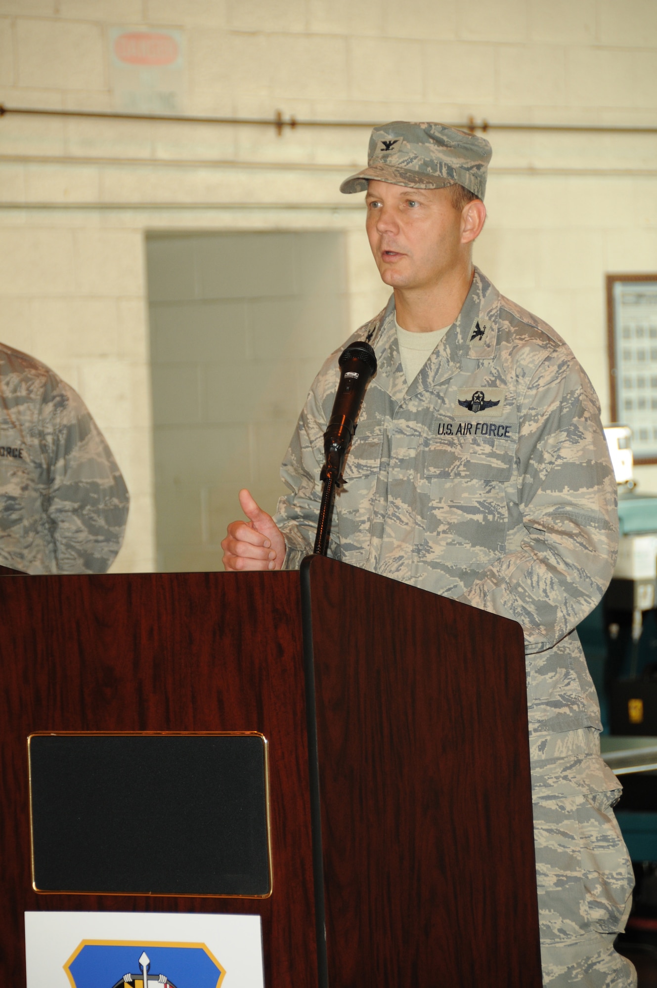 Col. Scott L. Kelly addresses members of the 175th Wing, Maryland Air National Guard, for the first time after assuming command of the wing during the wing assumption of command ceremony at Warfield Air National Guard Base, on August 1, 2009. (U.S. Air Force photo by TSgt. Chris Schepers/Released, 175th Wing/Public Affairs, WARFIELD AIR NATIONAL GUARD BASE, Maryland)