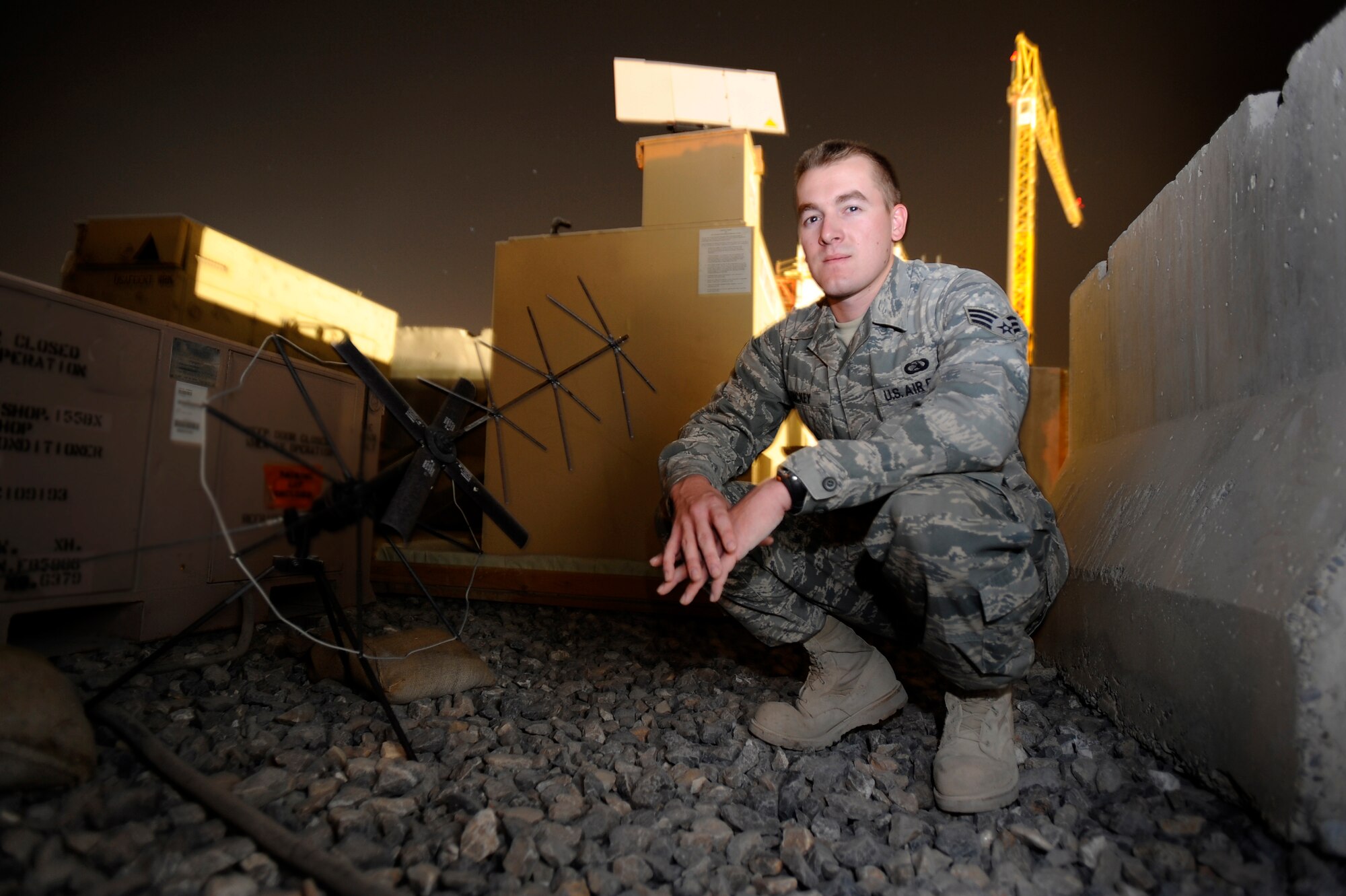 U.S. Air Force Senior Airman Russell Dickey combat communications radio operator  assigned to the 451st Expeditionary Aeromedical Evacuation flight, provides backup communications support for the critical medical evacuation mission, Kandahar Air Field, Afghanistan July 21. (U.S. Air Force Photo by Staff Sgt. Shawn Weismiller/Released)