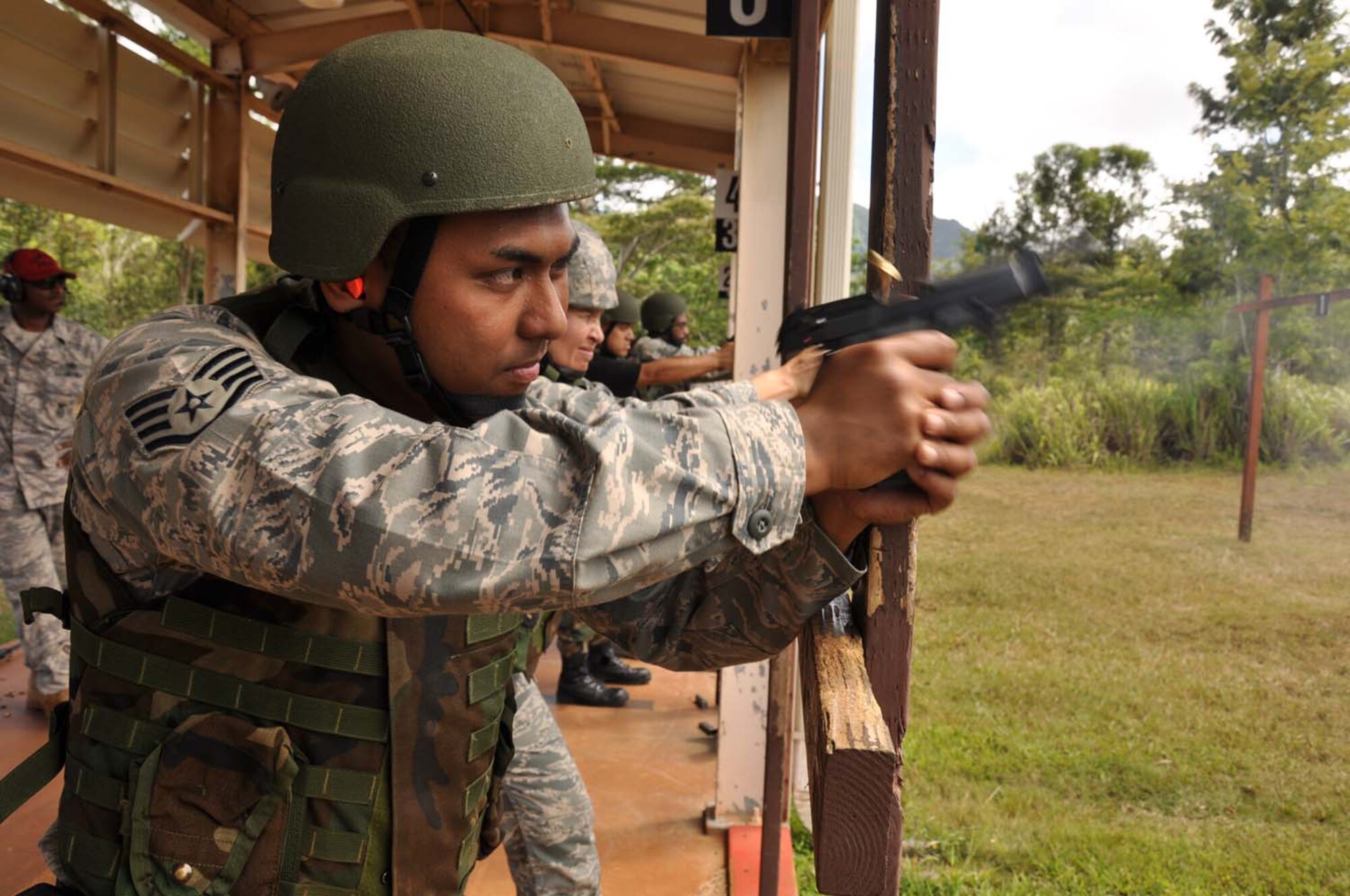 Staff Sgt. Jonathan Ariola, 624th Civil Engineer Squadron, hones his marksmenship skills prior to his deployment July 12 at the Combat Arms Training and Maintenance range Schofield Barracks, Hawaii. Sergeant Ariola is one of 54 Reservists from the 624th CES, which falls under the 624th Regional Support Group, who have been mobilized to deploy to Afghanistan for six months. This is a "partial" mobilization, meaning half the squadron is being mobilized as opposed to the entire squadron. Once in the AOR, the CE team will be supporting the Army at Bagram. (U.S. Air Force photo/Master Sgt. Daniel Nathaniel)