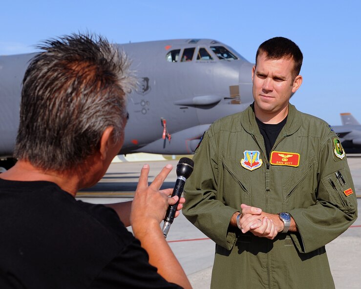 MINOT AIR FORCE BASE, N.D. -- Mr. Yuichiro Ando, a Segment Producer from the Japan Broadcasting Corporation based out of Los Angeles, interviews Captain Dave Mott, a Radar Navigator from the 23rd Bomb Squadron, during a B52 tour here August 4, 2009. Mr. Ando and two of his colleagues visited various areas on base to become familiarized with the nuclear reinvigoration process and tell the MAFB story to their viewer’s audience. (U.S. Air Force photo by Tech. Sgt. Linda C. Miller)