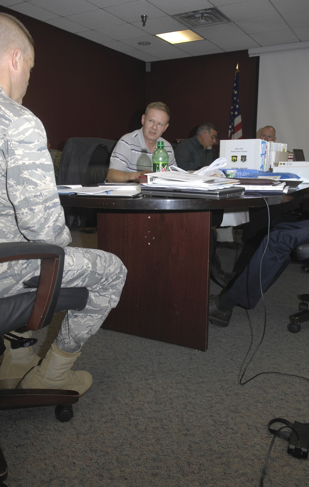 MINOT AIR FORCE BASE, N.D. -- Special Agent James Daywalt, Air Force vulnerability assessment (AFVA) terrorist operations specialist and Maj. Shaun Salyars, AFVA team chief, discuss the assessment here, Aug. 4.  The AFVA team is currently evaluating all vulnerabilities of an attack against the base and identifying areas of improvement to withstand, mitigate, or deter acts of violence and terrorism. (U.S. Air Force photo by: Airman 1st Class Benjamin Stratton)