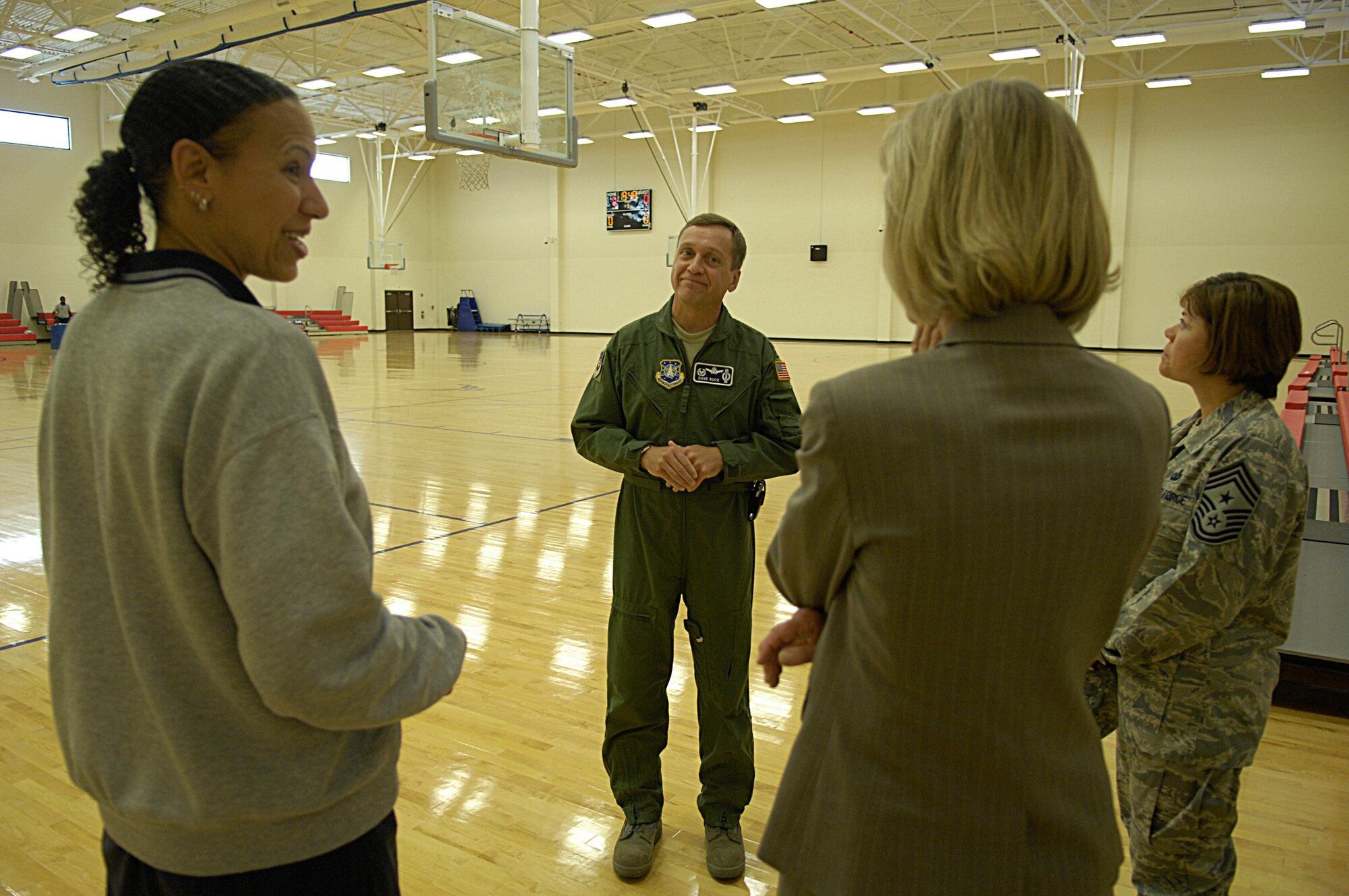 VANDENBERG AIR FORCE BASE, Calif. -- Taking a look at the Vandenberg Fitness Center basketball court, Ms. Pam Coffey, left, the Fitness and Sports Center director, Col. David Buck, center, the 30th Space Wing commander, and Chief Master Sgt. Angelica Johnson, far right, the 30th SW command chief, show off Vandenberg's new fitness center to Rep. Lois Capps of California on Aug. 4 here. Ms. Capps toured a variety of Vandenberg's facilities during her visit to the base. (U.S. Air Force photo/Senior Airman Matthew Plew)