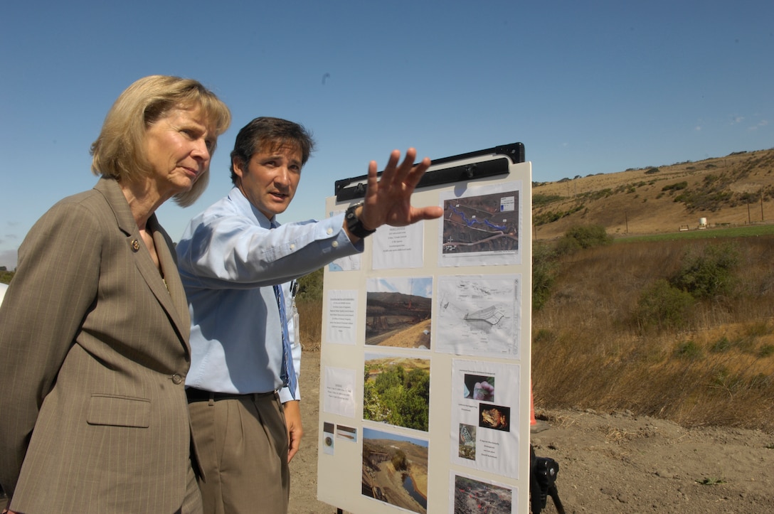 VANDENBERG AIR FORCE BASE, Calif. --  During a base visit Aug. 4, Rep. Lois Capps of California views the carefully restored landscape of San Antonio Creek as Tom DeVenoge, the 30th Civil Engineer Squadron's chief of conservation, explains the progression made to prevent erosion damage close to San Antonio Road here. Ms. Capps toured a variety of Vandenberg's facilities, including San Antonio Creek and the newly remodeled base clinic. (U.S. Air Force photo/Senior Airman Matthew Plew)