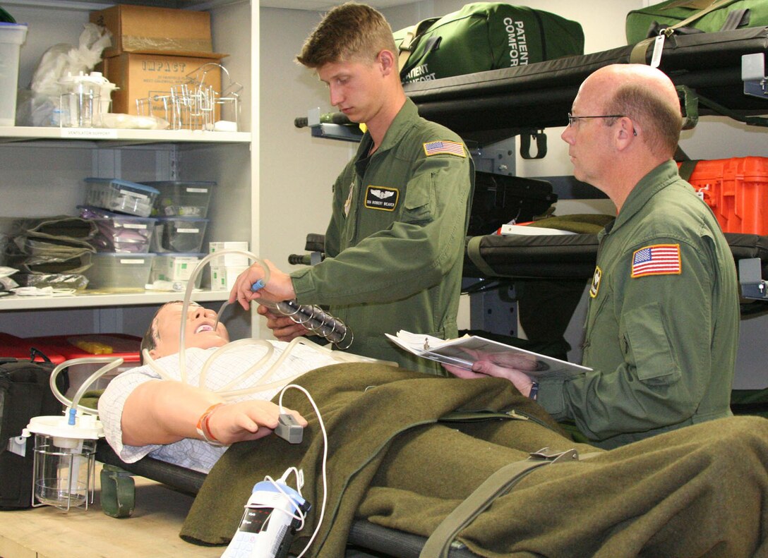 Senior Airman Robert Weaver, an aeromedical evacuation technician for the 911th Aeromedical Evacuation Squadron, undergoes his annual emergencyprocedures evaluation. Airman Weaver demonstratesthe proper procedure for setting up to intubate a patient while in flight. The 911 AES was recently named the Reserve Officers Association’s 2008 Air Section Outstanding Medical Unit. (Photo by Tech. Sgt. Scott Pryor)