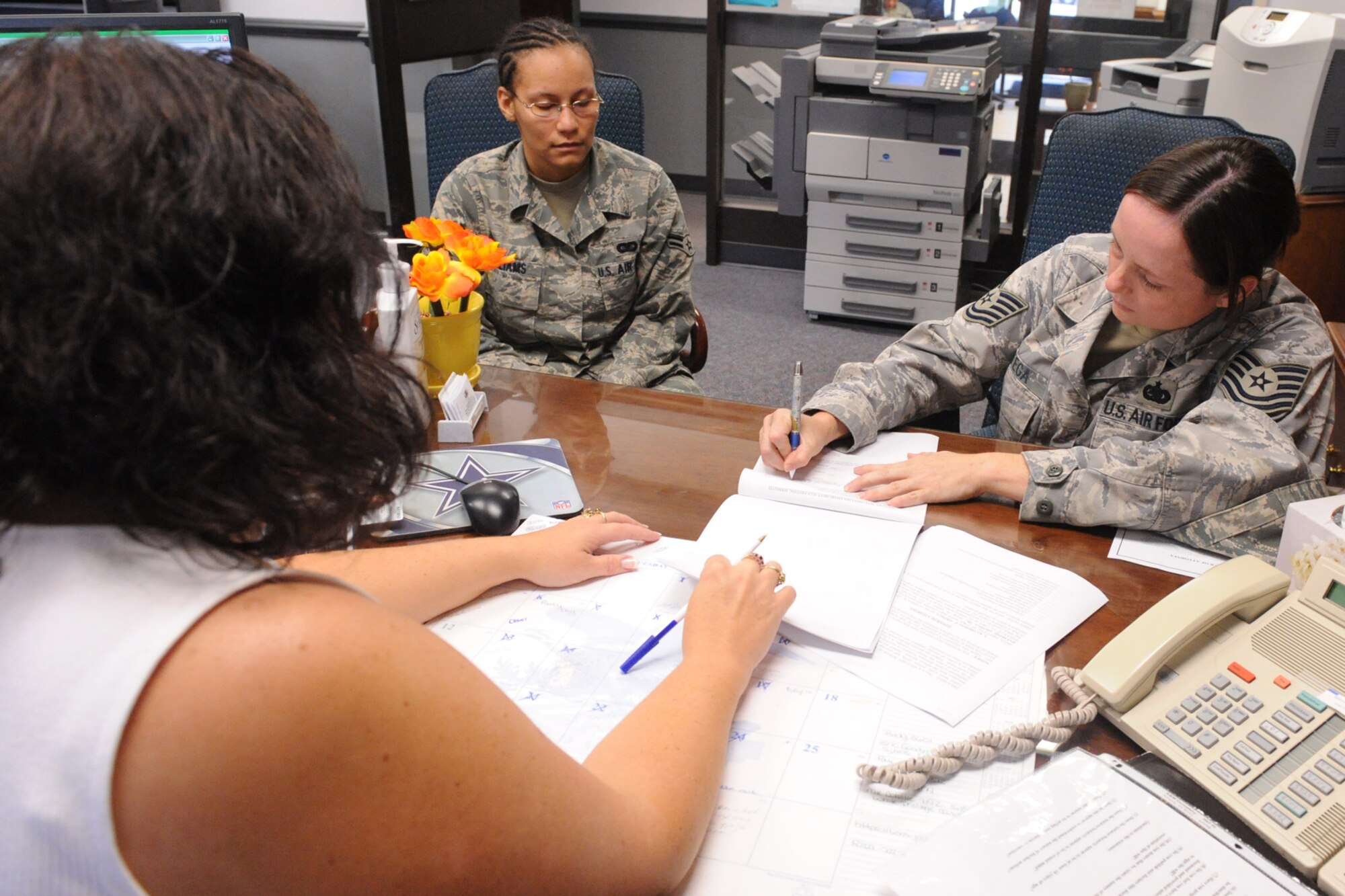 Technical Sgt. Katherine Ortega, 335th Fighter Squadron supply non-commissioned officer in charge, signs her will on Seymour Johnson Air Force Base, N.C., July 30, 2009. Sergeant Ortega has a will drawn to take care of her family while she is deployed. The legal office writes an average of 15 wills per week. (U.S. Air Force photo by Airman 1st Class Whitney S. Lambert)  