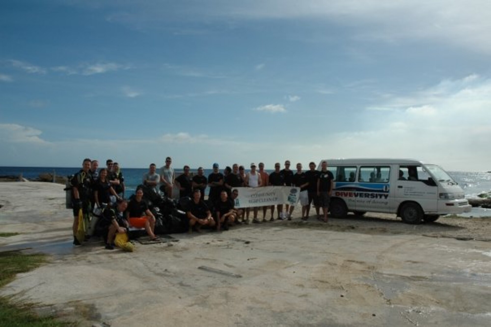 A group of deployed Airmen from the 964th Expeditionary Airborne Air Control Squadron worked with a team of volunteers to help clean up a section of beach and coral reefs as a service to the community.