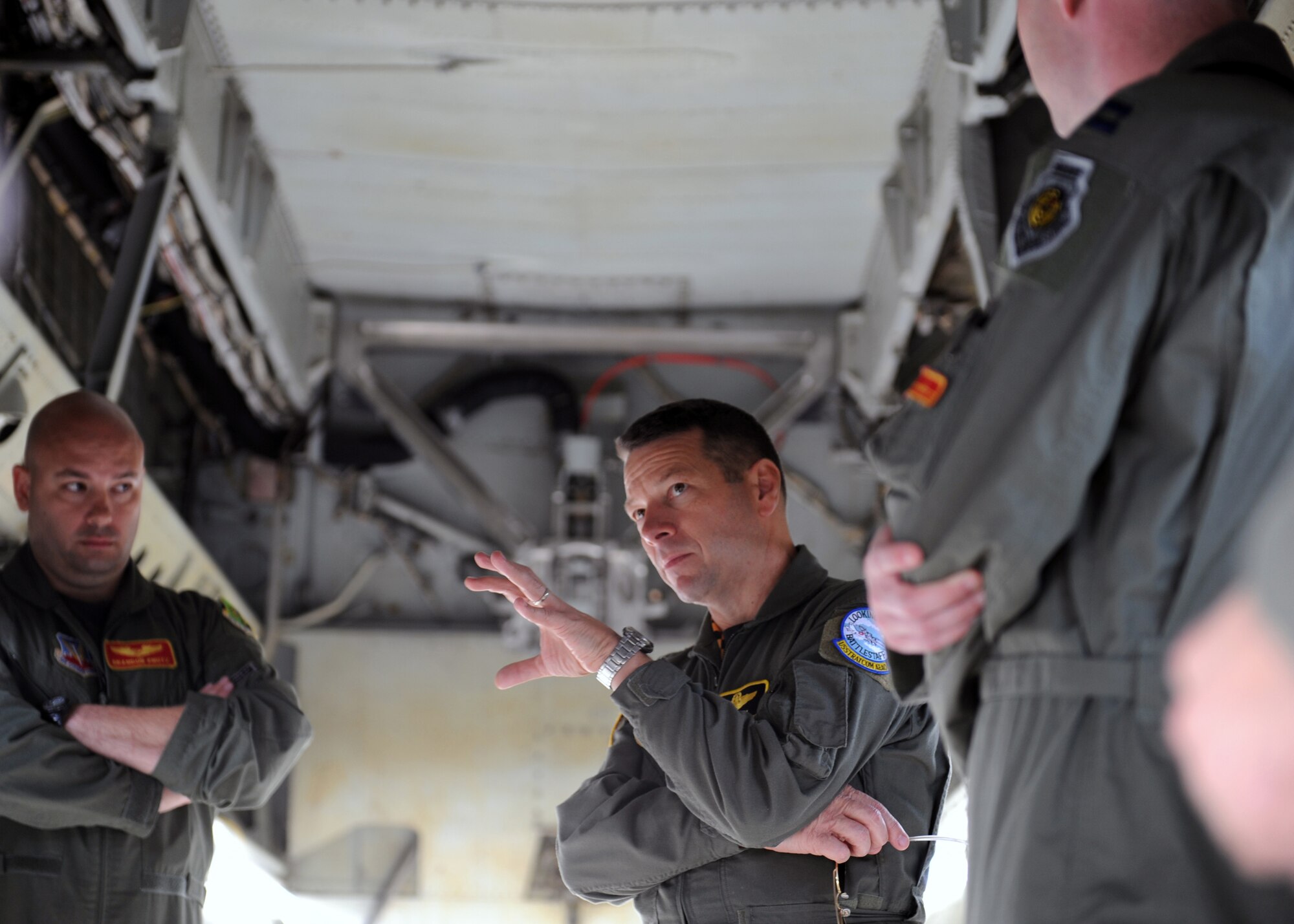 MINOT AIR FORCE BASE, N.D. -- Brig. Gen. Joseph Brown, U.S. Strategic Command (USSTRATCOMM) deputy director for nuclear operations, discusses the capabilities of the B-52H Stratofortress with Capt. Brandon Knutz, 23rd Bomb Squadron personnel reliability program monitor, and other squadron members here, Aug. 4.  Brig. Gen. Brown visited the base as part of the USSTRATCOMM Road Show which is designed to review and reinvigorate each bases’ aircrews and thus enhance the mission. (US Air Force photo by Staff Sgt. Keith Ballard)