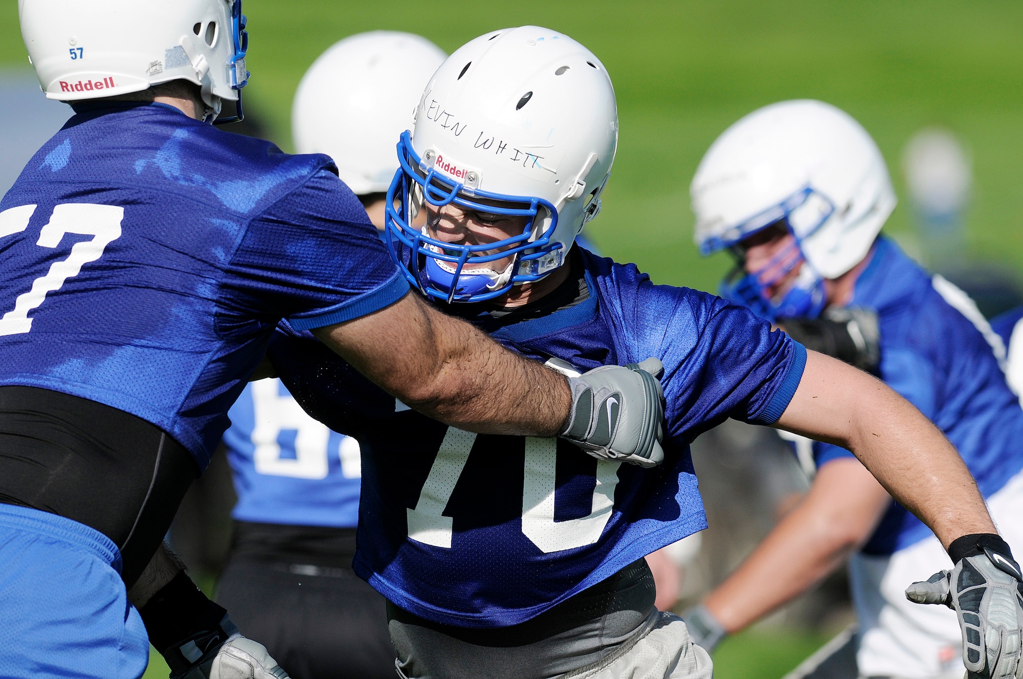 Air Force Academy senior offensive linesman Nick Charles blocks sophomore Kevin Whitt during football practice Aug. 4 in day 2 of football practice at the Academy practice field.  Charles was recently named a preseason first-team all-Mountain West Conference selection.  The Falcons host the Nicholls State Colonels Sept. 5 in their home opener.  (U.S. Air Force photo/Mike Kaplan)