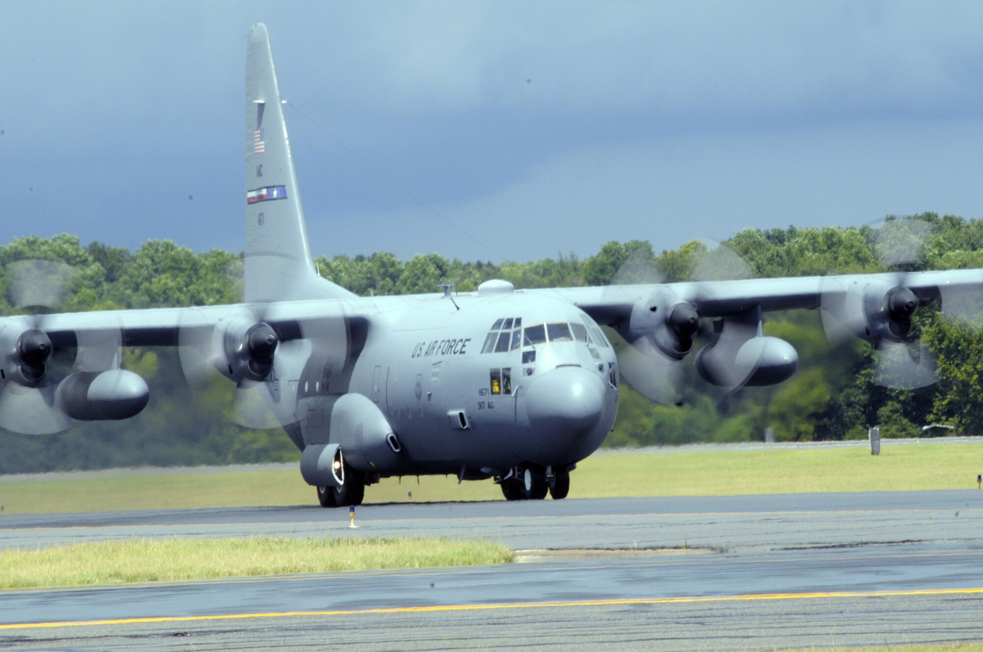 A C-130 taxies on the flight line at Robins July 31. It will be the first aircraft to undergo High Velocity Maintenance, which means it will be used to test the new method of programmed depot maintenance aimed at reducing aircraft downtime. (U. S. Air Force photo by Sue Sapp)