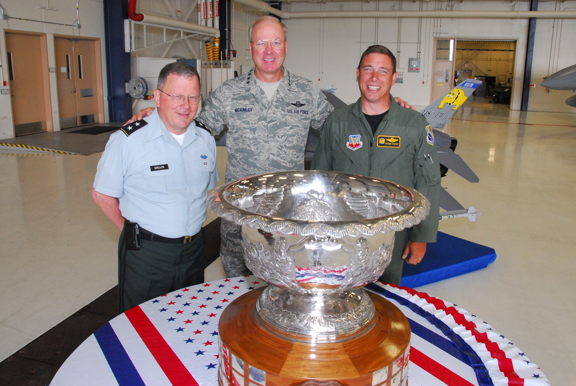 U.S. Army Major General Larry Shellito (left), Adjutant General of the Minnesota National Guard, and U.S. Air Force Col. Frank Stokes (right), Commander of the 148th Fighter Wing, Duluth, Minn., poses with General Craig R. McKinley-Chief, National Guard Bureau, as he attends a celebration at the wing for the Raytheon Trophy presentation July 31, 2009 in Duluth, Minn.  The Raytheon Trophy was awarded to the 179th Fighter Squadron of the 148th Fighter Wing as the most outstanding air defense unit in the U.S. Air Force, marking only the fourth time an Air National Guard unit received this award since its inception in 1953.  (U.S. Air Force photo by Tech. Sgt. Brett R. Ewald)