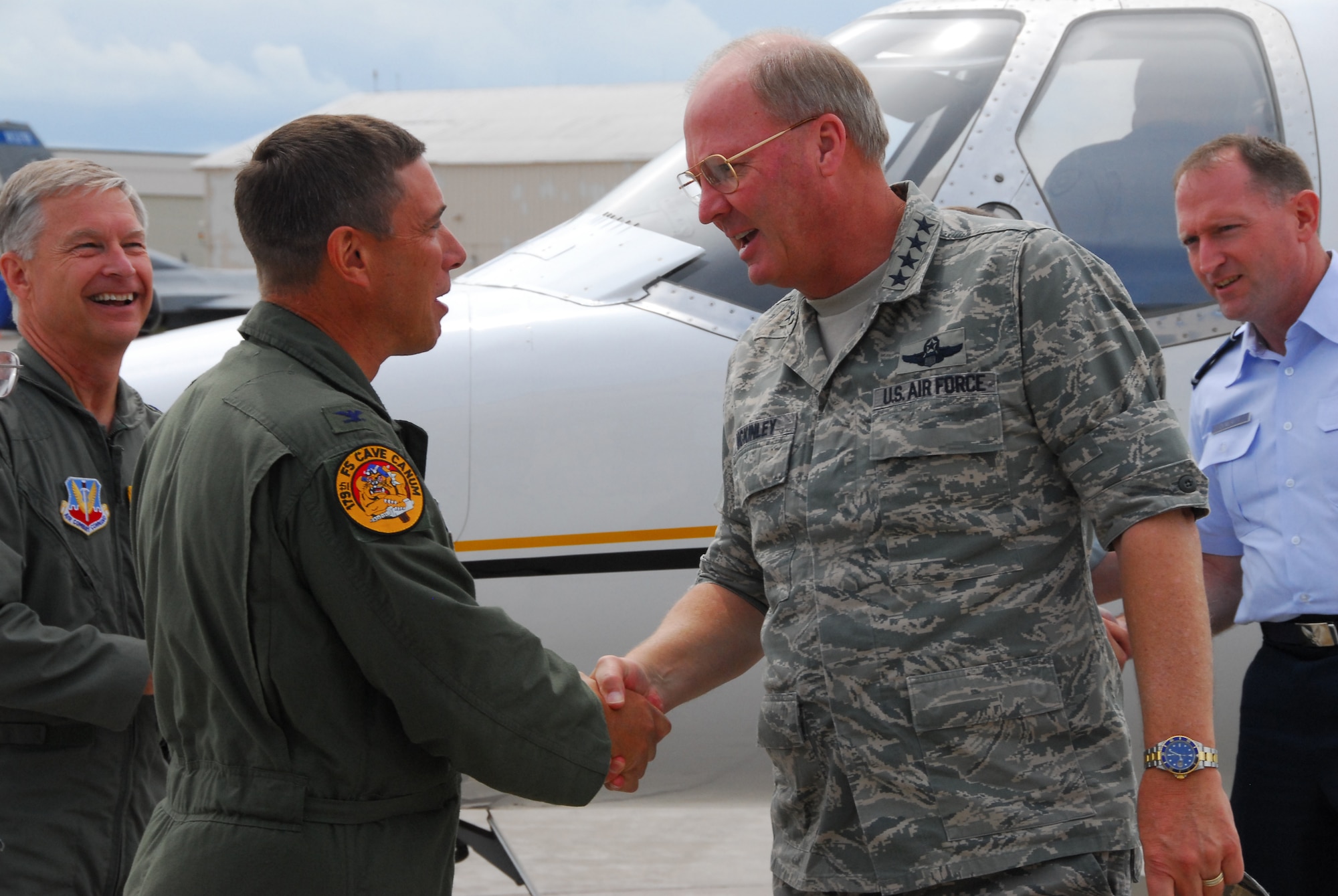 U.S. Air Force Col. Frank Stokes, Commander of the 148th Fighter Wing, Duluth, Minn., greets General Craig R. McKinley-Chief, National Guard Bureau, as he arrives at the wing for the Raytheon Trophy presentation July 31, 2009 in Duluth, Minn.  The Raytheon Trophy was awarded to the 179th Fighter Squadron of the 148th Fighter Wing as the most outstanding air defense unit in the U.S. Air Force, marking only the fourth time an Air National Guard unit received this award since its inception in 1953.  (U.S. Air Force photo by Tech. Sgt. Brett R. Ewald)