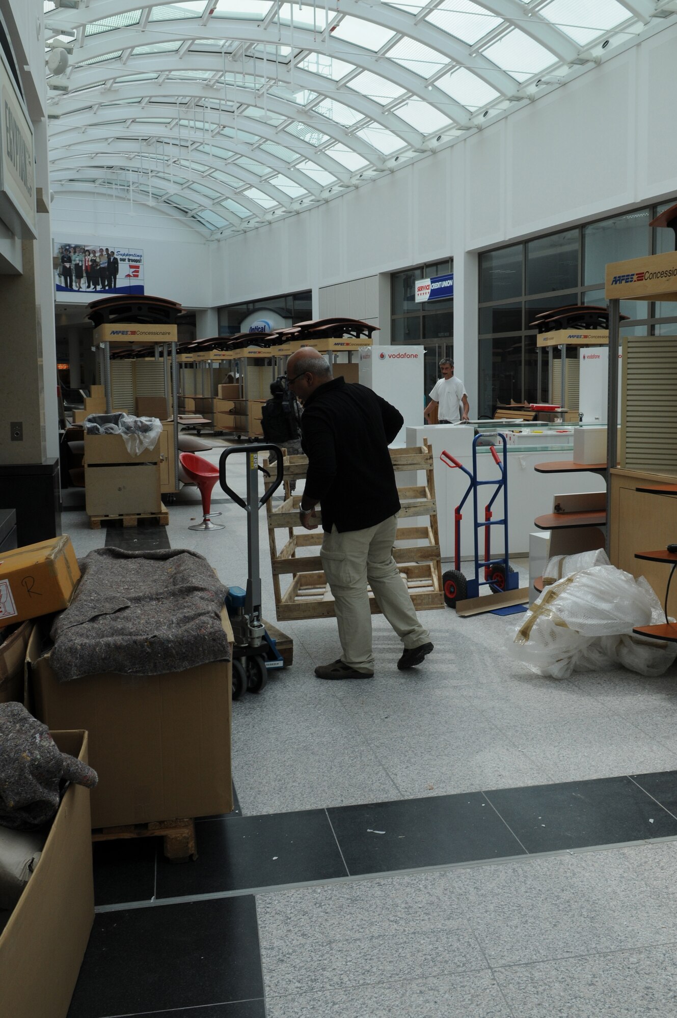 AAFES employees work to get the new Concession stores open and ready for customers at the new Kaiserslautern Military Community Center, Ramstein Air Base, Germany, Aug. 3, 2009.  The Mall, food court, and concessions are part of the phase II openings in the KMCC scheduled to open 15 August. (U.S. Air Force photo by Airman 1st Class Caleb Pierce)