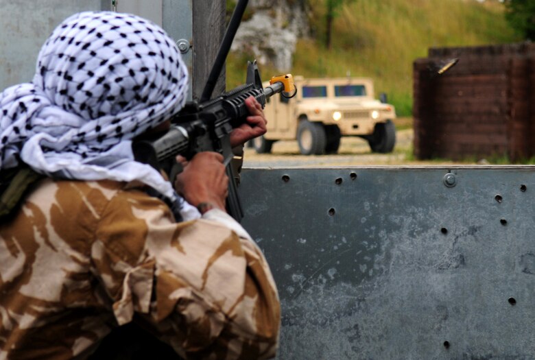 U.A. Air Force Tech. Sgt. Daniel Benavidez, a Tactical Air Control Party, Joint Tactical Air Controller, from the 2nd Air Support Operations Squadron, plays an insurgent during a convoy exercise in Allied Strike, Grafenwoehr, Germany, Aug. 3, 2009. Allied Strike a multi-service, multi-national exercise presents realistic scenarios for participants to hone skills before deploying. (U.S. Air Force photo by Staff Sgt. Jocelyn Rich)