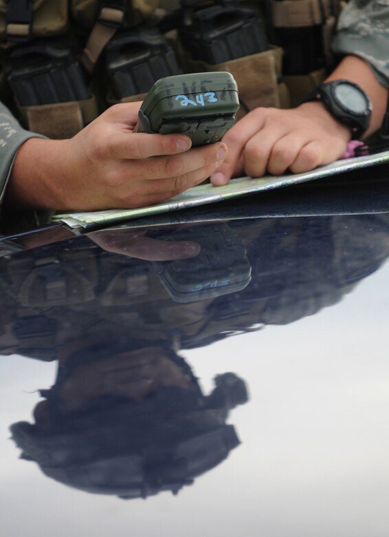 U.S. Air Force Senior Airman Richard Garrett, a Tactical Air Control Party, ROMAD from the 1st Air Support Operations Squadron, in-puts information at the start point of a scenerio of Allied Strike, Grafenwoehr, Germany, Aug. 3, 2009. Allied Strike a multi-service, multi-national exercise presents realistic scenarios for participants to hone skills before deploying. (U.S. Air Force photo by Staff Sgt.  Jocelyn Rich)
