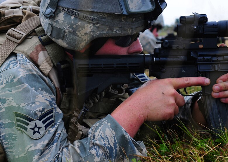 U.S. Air Force Senior Airman Richard Garrett, a Tactical Air Control Party ROMAD from the 1st Air Support Operations Squadron, secures his position during Allied Strike, Grafenwoehr, Germany, Aug. 3, 2009. Allied Strike a multi-service, multi-national exercise presents realistic scenarios for participants to hone skills before deploying. (U.S. Air Force photo by Staff Sgt. Jocelyn Rich)