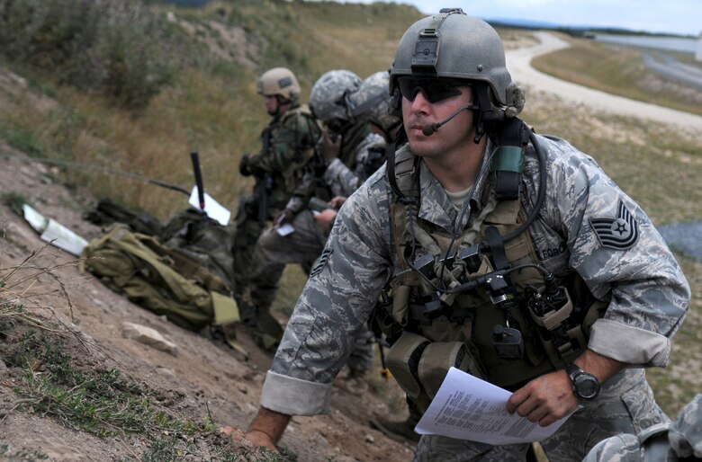 U.S. Air Force Tech. Sgt. Shawn Leonard from the 11th Air Support Operations Squadron, Ft. Hood, Tx. acts as Army ground commander during an air strike scenario at Allied Strike, Grafenwoehr, Germany.  Allied Strike a service, multi-national exercise presents realistic scenarios for participants to hone skills before deploying. (U.S. Air Force photo by Staff Sgt. Jocelyn Rich)