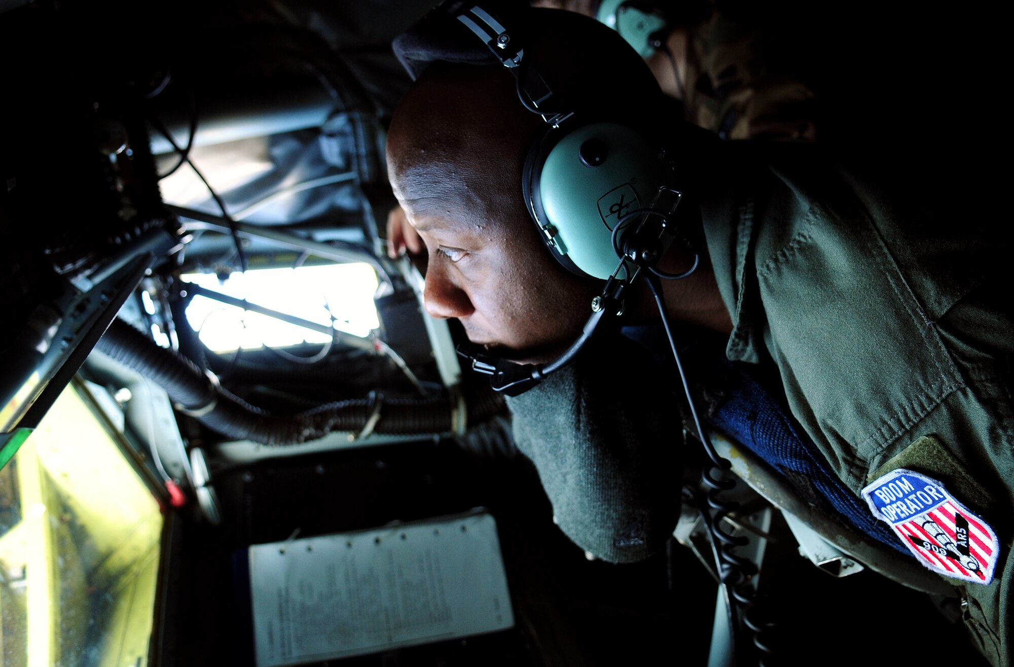 Staff Sgt. Ron McKinney, a KC-135 boom operator with the 909th Air Refueling Squadron, Kadena Air Base, guides the boom for a Japan Air Self Defense Force F-15 as the pilot practices air refueling July 30. The training is in preparation for JASDF participation in Red Flag Alaska this year. (U.S. Air Force photo/Tech. Sgt. Angelique Perez) 