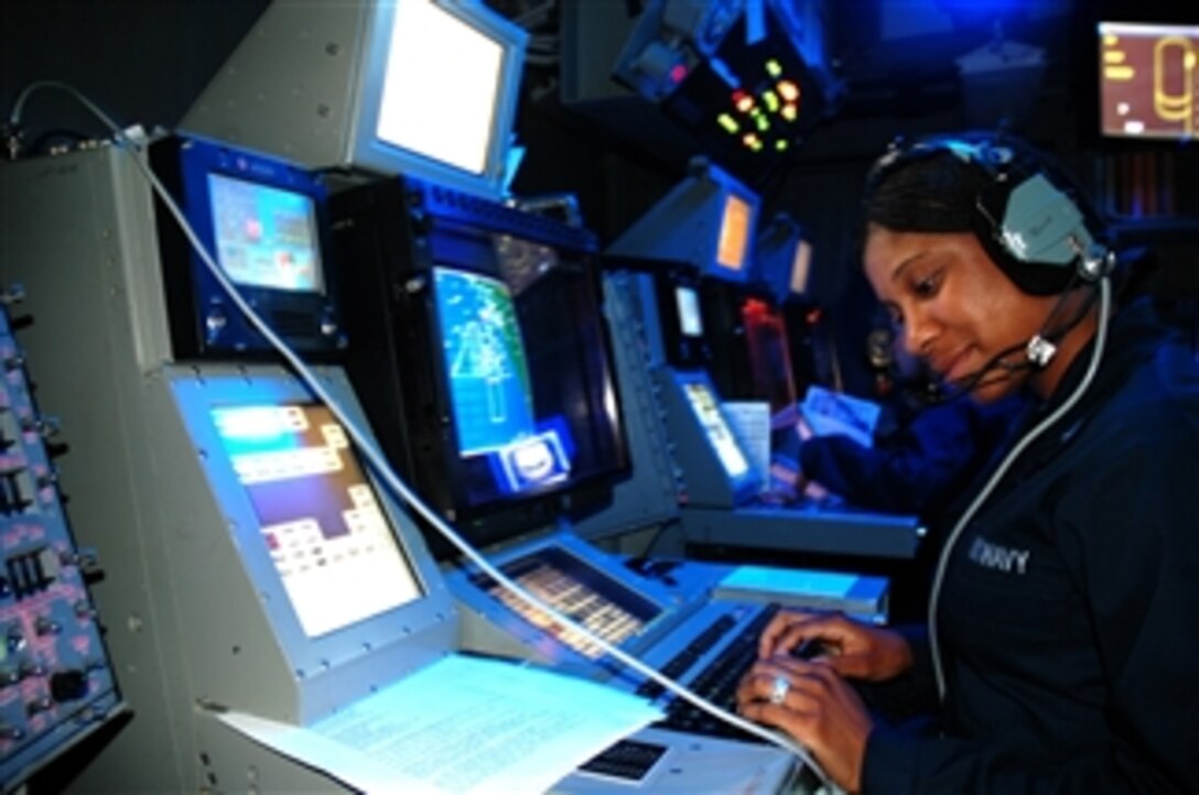 U.S. Navy Petty Officer 3rd Class Wendy Rambo identifies air contacts and issues queries to unknown aircraft approaching the aircraft carrier USS Nimitz (CVN 68) underway in the Pacific Ocean on July 27, 2009.  The Nimitz and Carrier Air Wing 11 are conducting operations off the coast of southern California in preparation for a scheduled deployment to the western Pacific Ocean.  