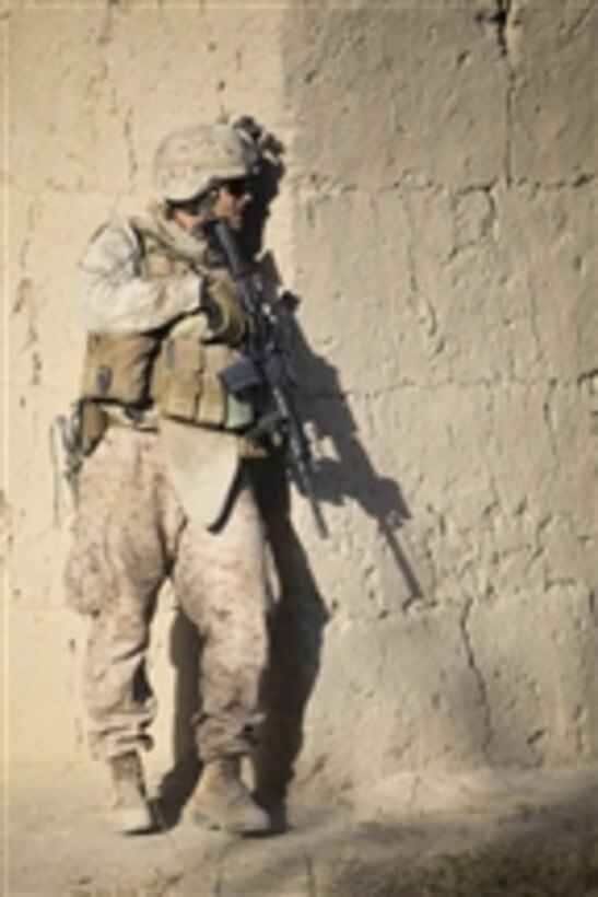 U.S. Marine Corps Maj. Jay Lappe, an operations officer with 1st Battalion, 5th Marine Regiment, provides security during a road reconnaissance patrol in the Nawa district of Helmand province, Afghanistan, on Aug. 1, 2009.  The Marines are trying to improve transportation for civilians and Afghan National Army soldiers by improving damaged roads and bridges.  The Marines are deployed to support NATO's International Security Assistance Force and will participate in counter insurgency operations.  They will train and mentor Afghan National Security Forces to improve security and stability in the country.  